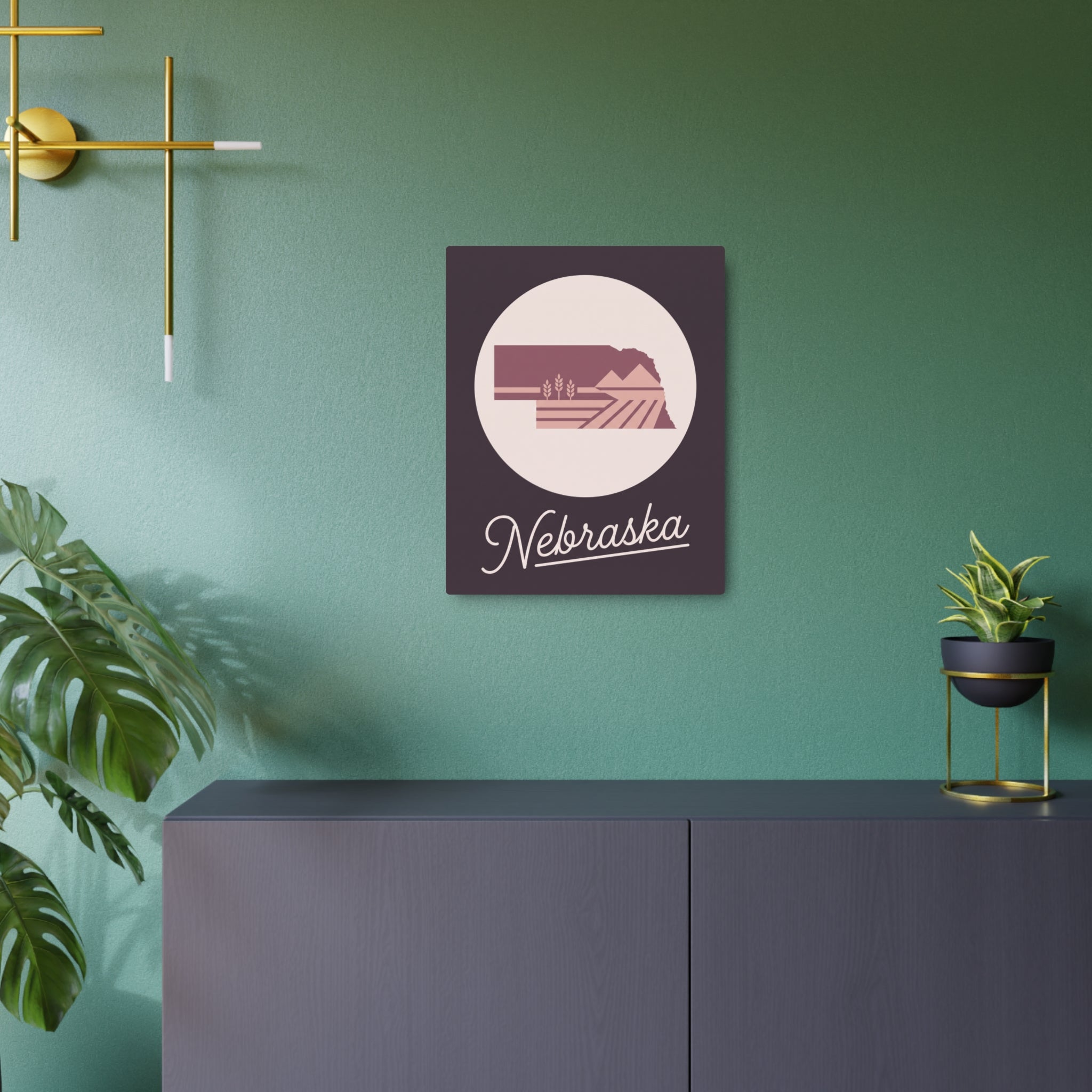 Mauve metal Nebraska wall art with circular landscape emblem and cursive 'Nebraska' text.
