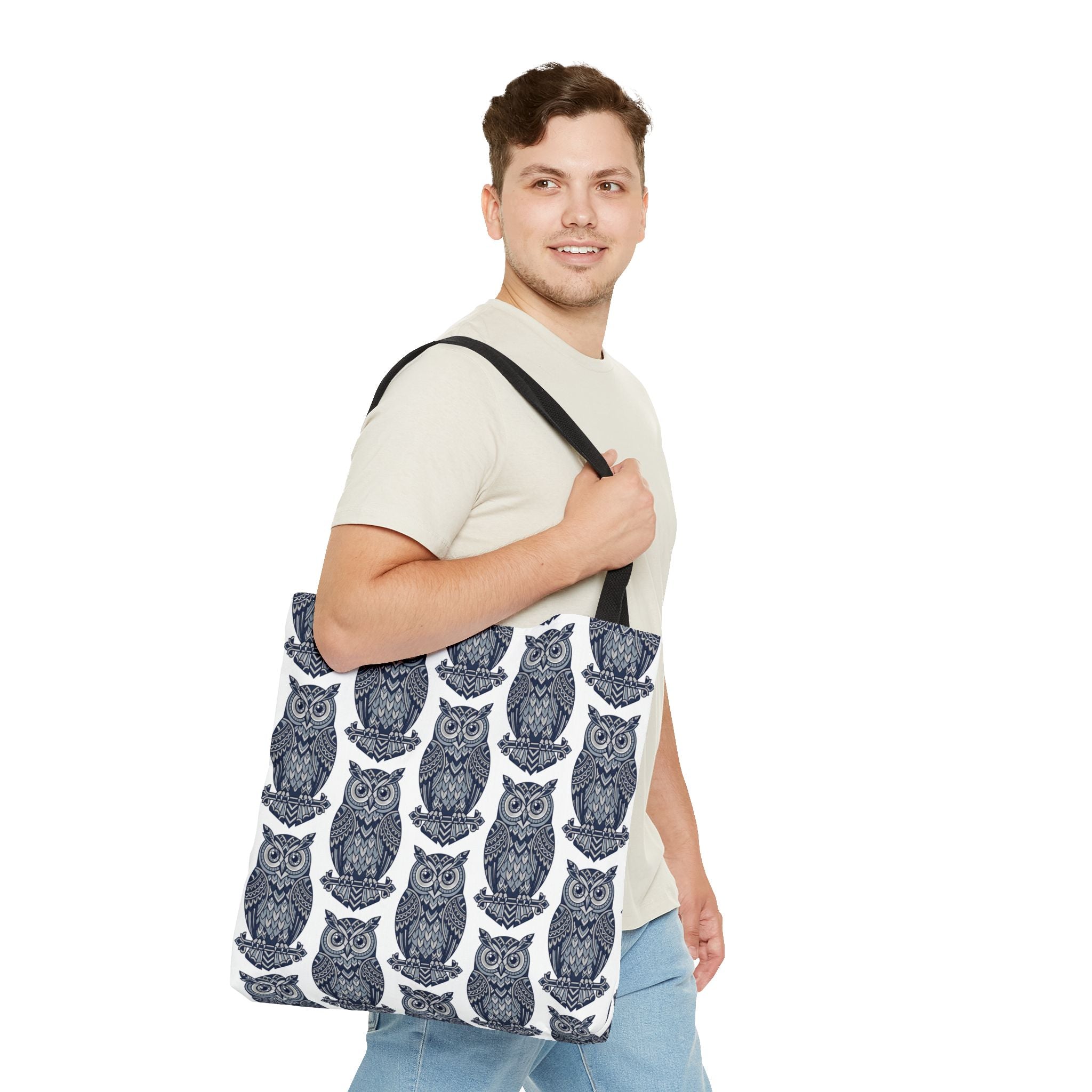 Owl pattern tote bag with black handles, worn on shoulder; blue and white owl repeat.