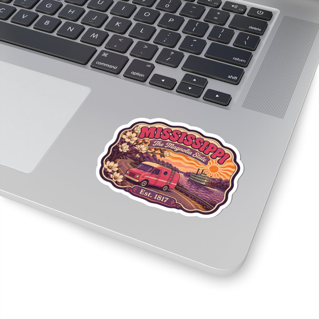 Mississippi state sticker on laptop, white die-cut border; pink retro camper and floral art