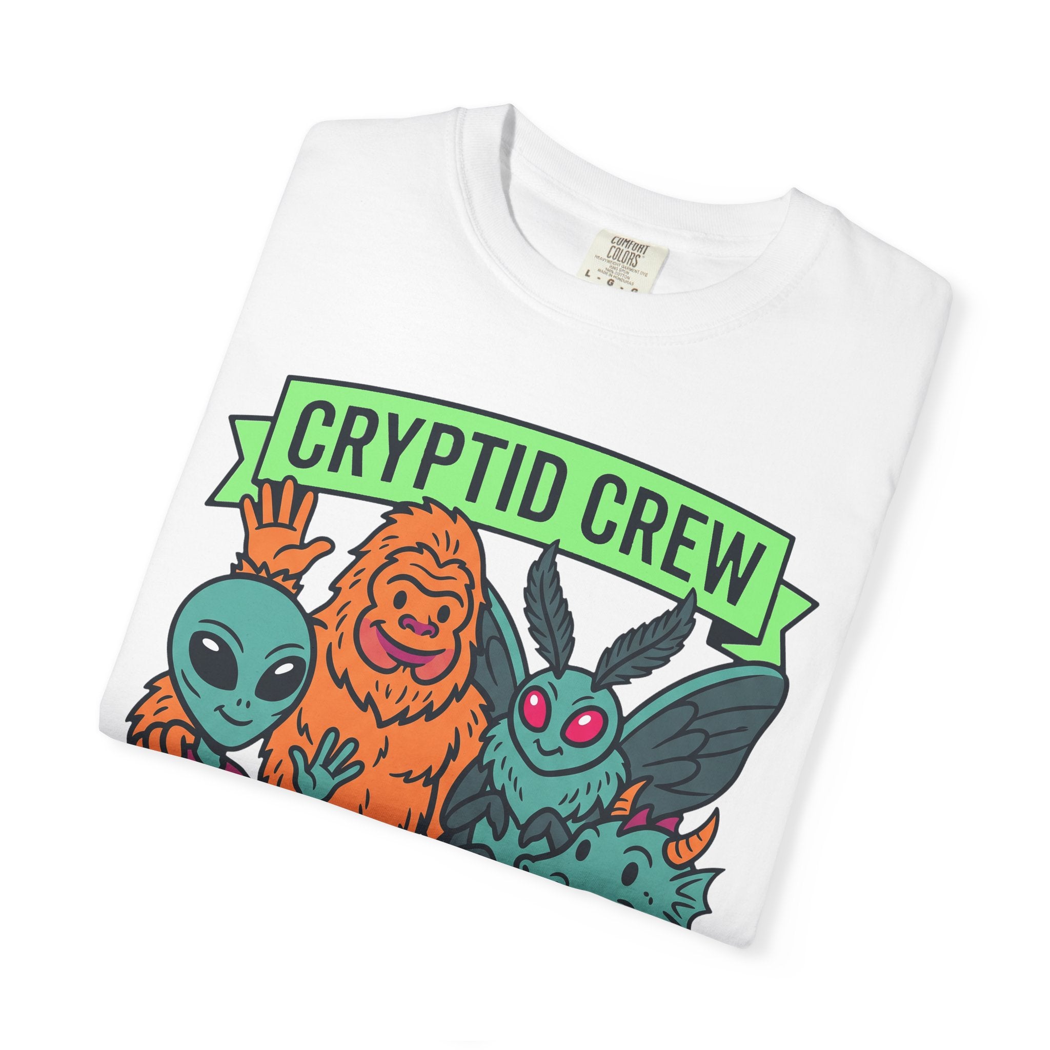 White T-shirt with green CRYPTID CREW banner and alien creature artwork