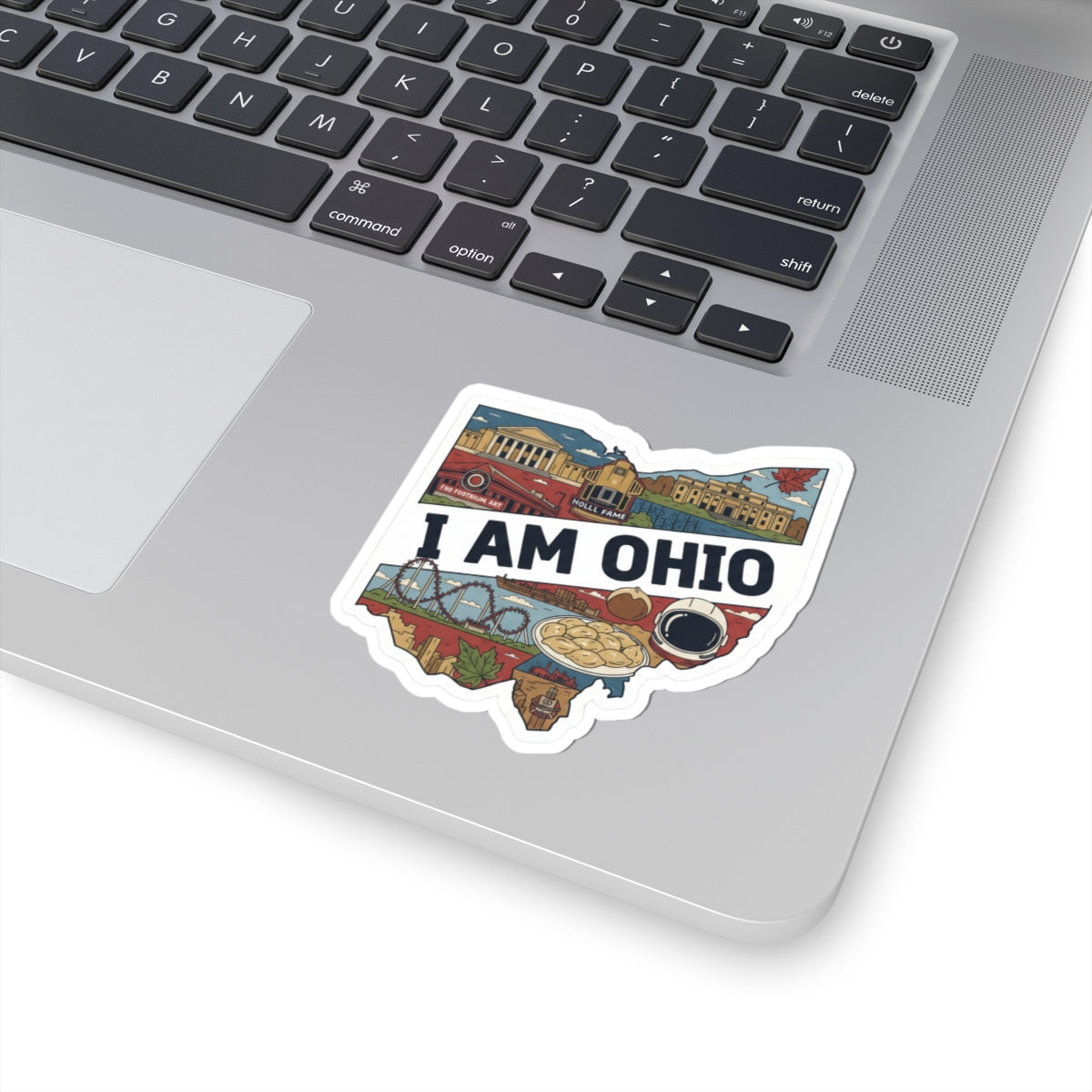 I AM OHIO sticker on white backing, shown on laptop keyboard