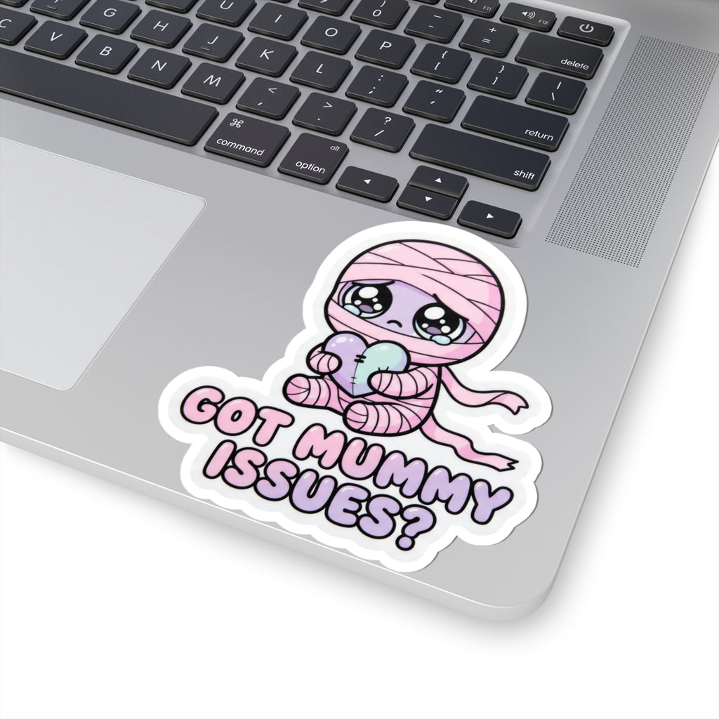 Baby mummy sticker with pink hood holding heart, “GOT MUMMY ISSUES?” lettering