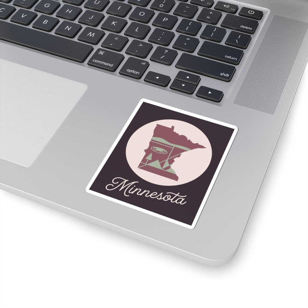Rectangular Minnesota sticker on laptop, showing state silhouette and script “Minnesota”