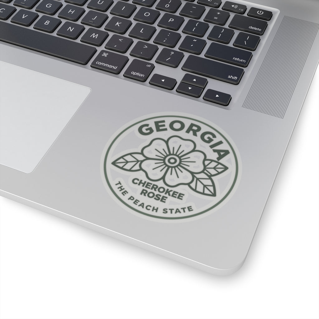 Circular Georgia decal with Cherokee Rose and The Peach State text on a laptop