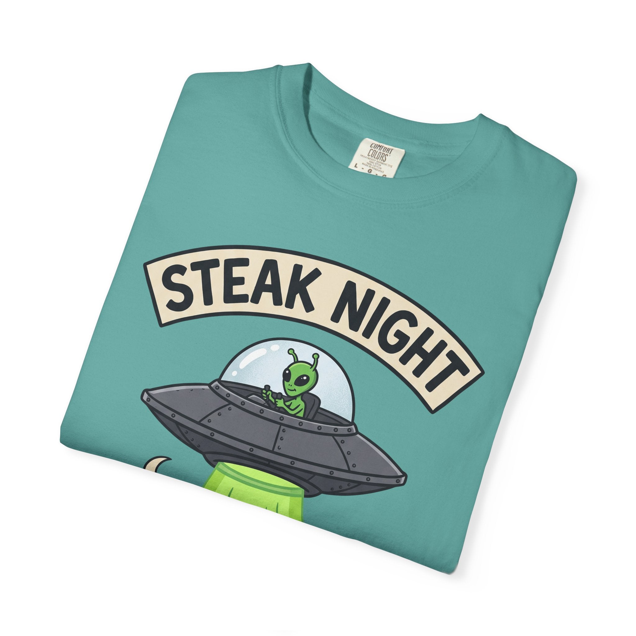 Teal graphic T-shirt with 'STEAK NIGHT' UFO and alien cow illustration.