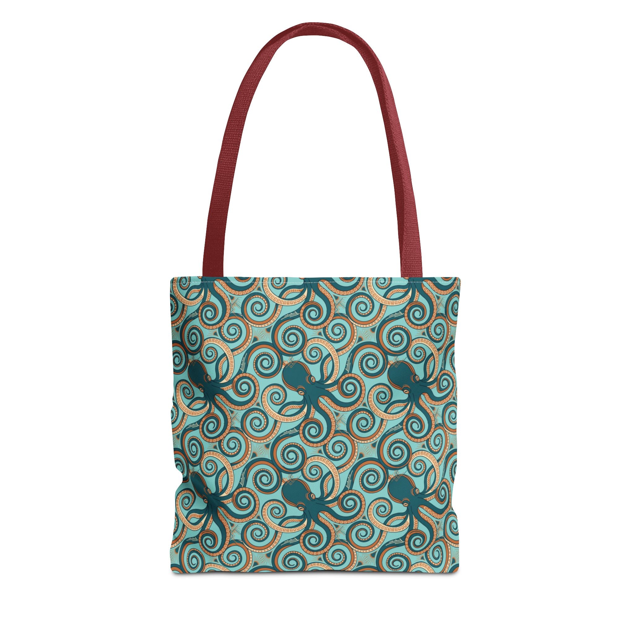 Teal tote bag with all-over octopus swirl pattern and red handles