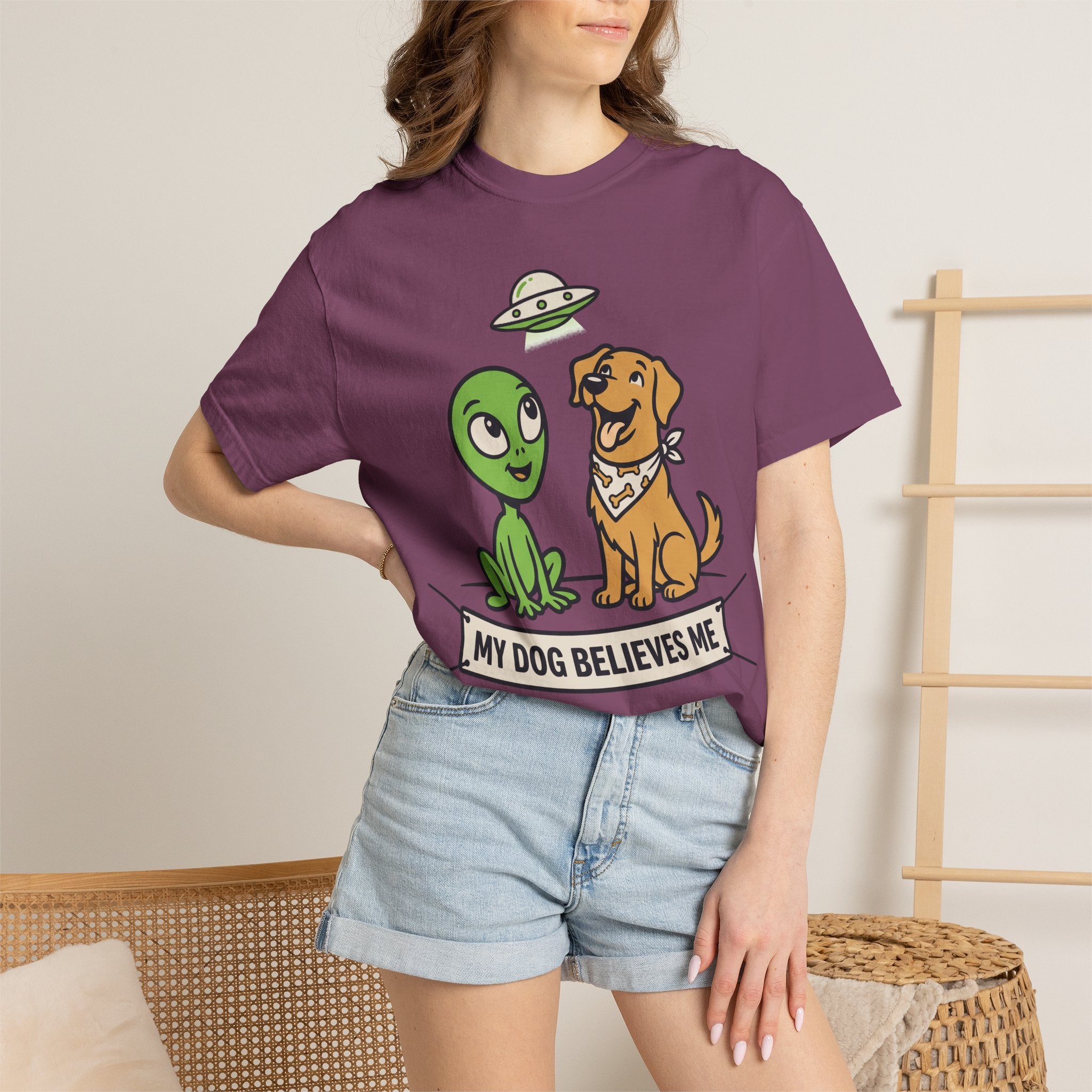 Plum T-shirt with alien and dog cartoon graphic at center chest