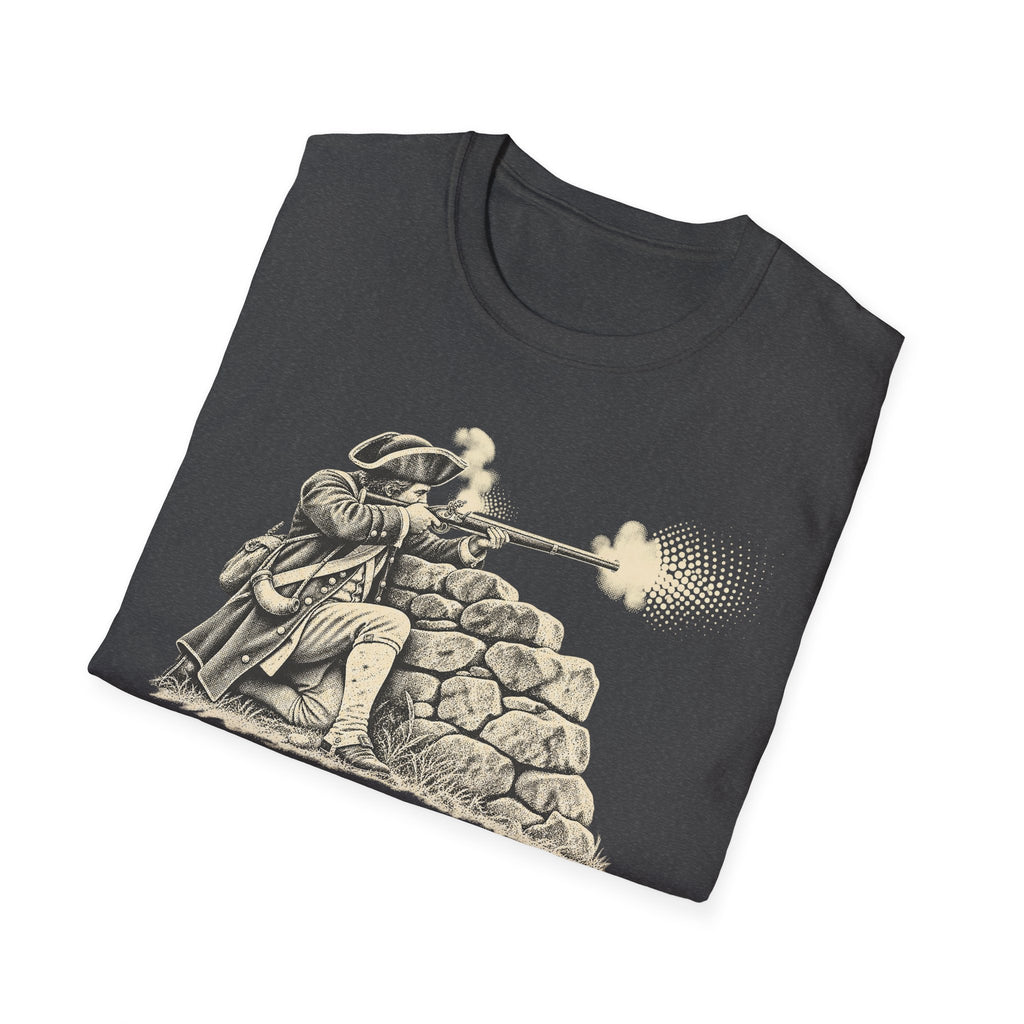 Dark charcoal T-shirt laid flat with colonial patriot graphic behind stone wall