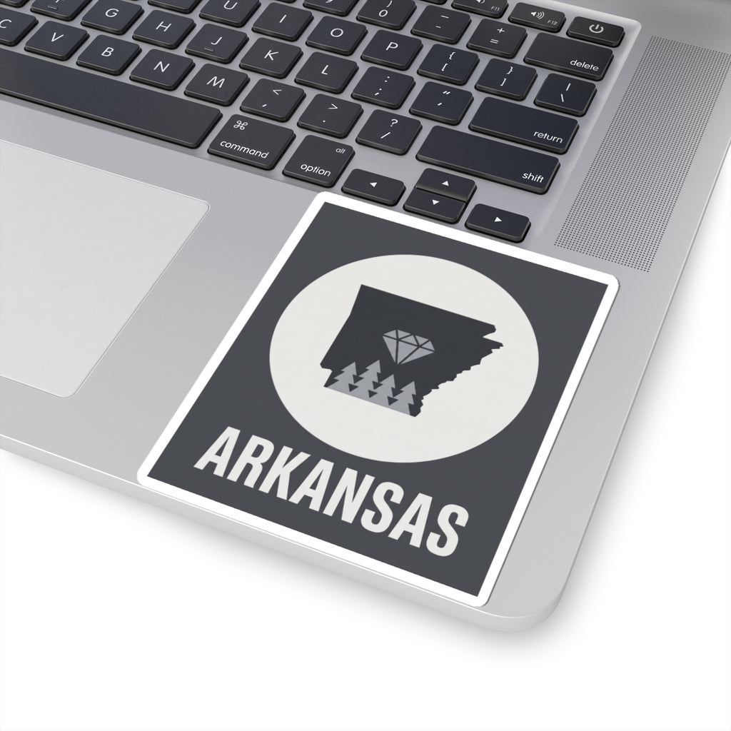 Arkansas vinyl decal on laptop: dark state graphic, diamond trees, circular field, ARKANSAS