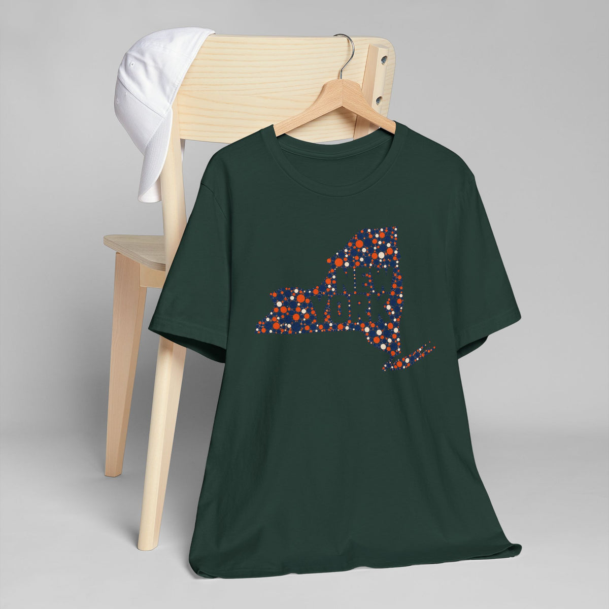 Forest green T-shirt with colorful dotted New York state outline graphic