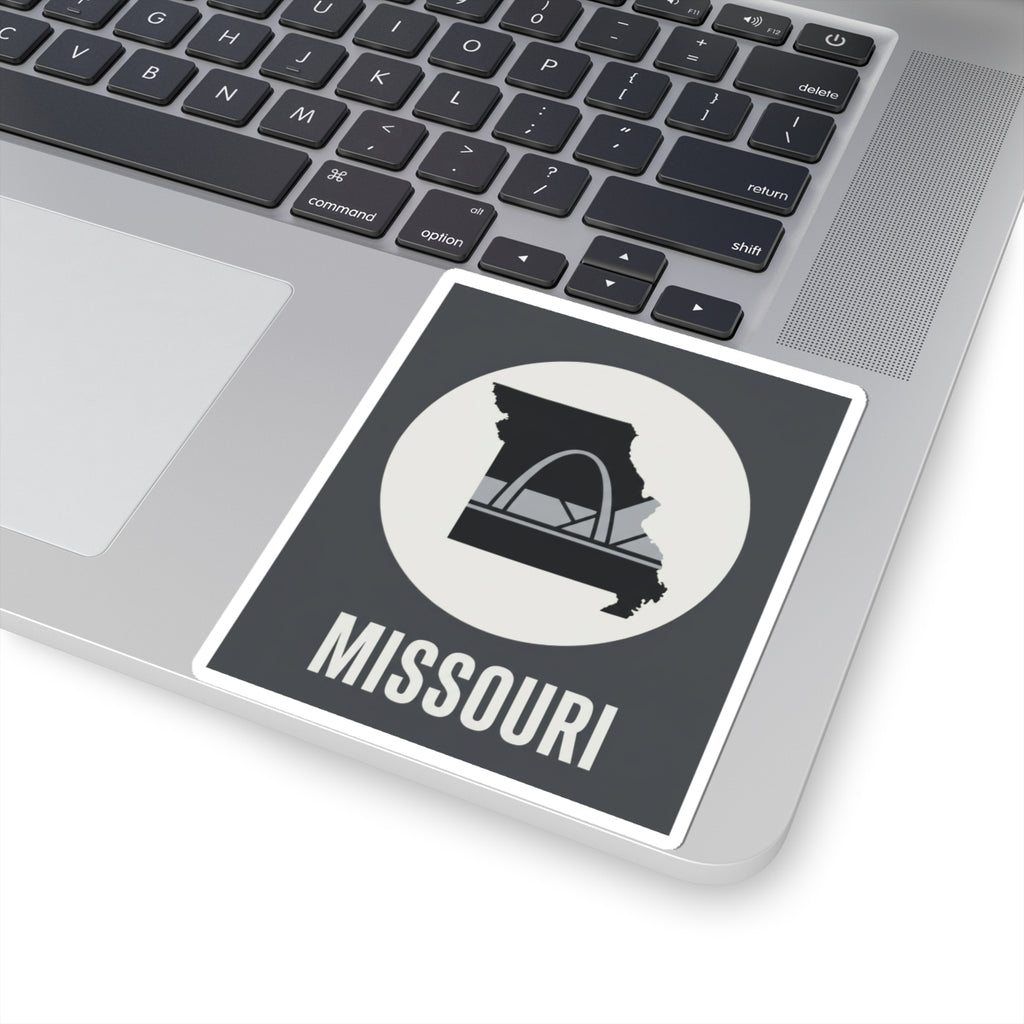 Missouri sticker on a laptop showing circular Gateway Arch icon and “MISSOURI” text