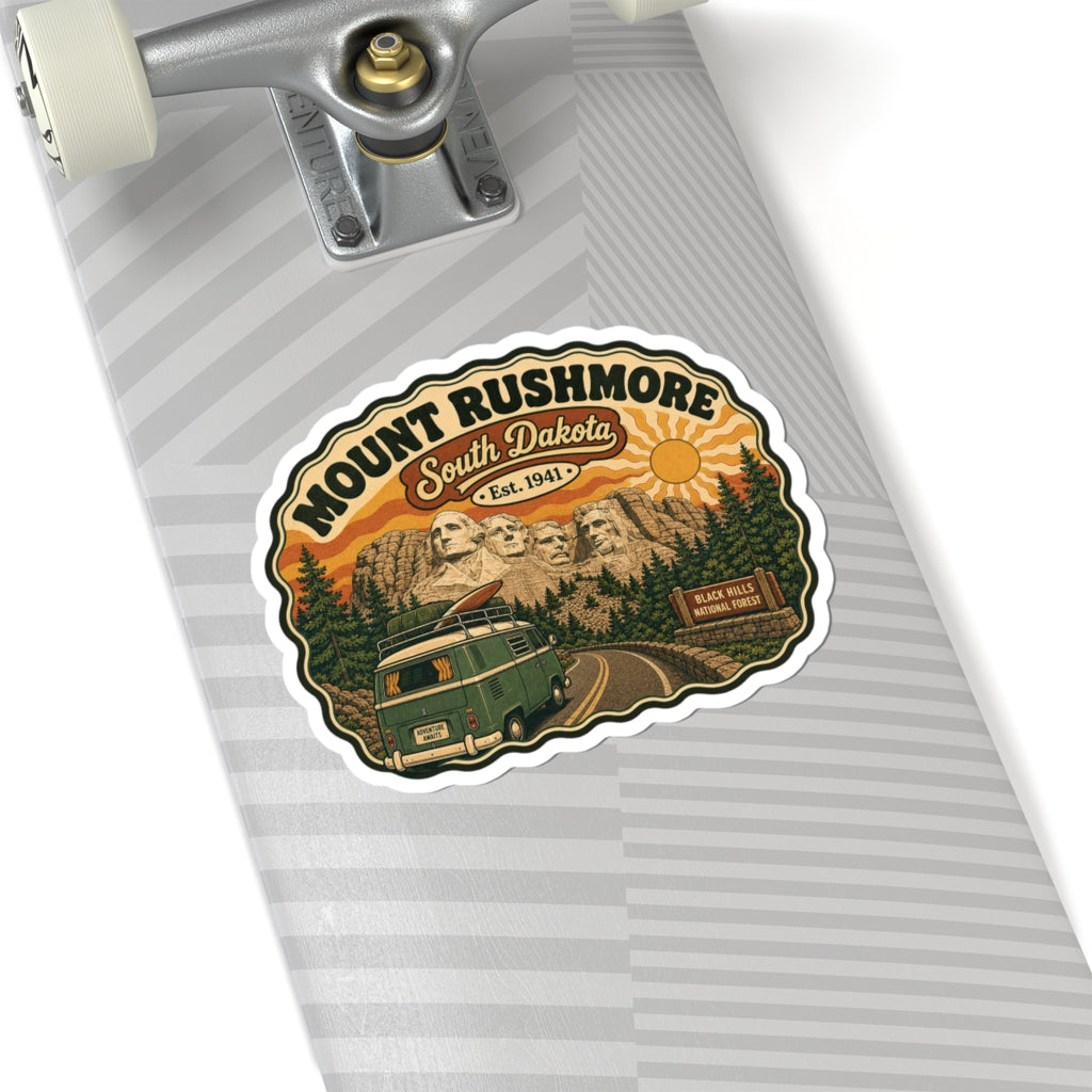 Die-cut sticker on notebook cover, showing Mount Rushmore, South Dakota, and green van