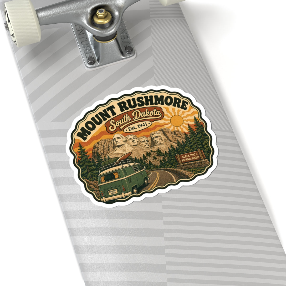 Die-cut sticker on notebook cover, showing Mount Rushmore, South Dakota, and green van