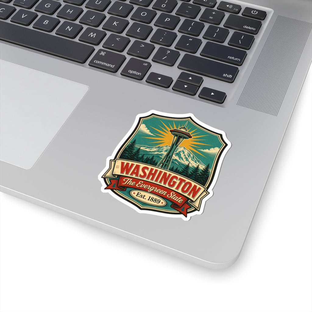 Washington State vinyl decal sticker on a laptop lid, showing Space Needle and mountain landscape