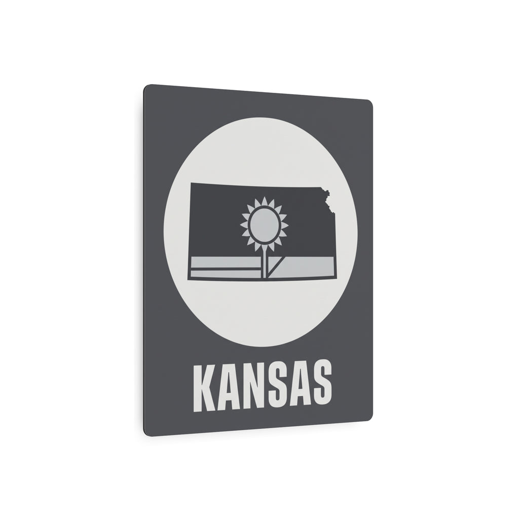 Dark gray metal Kansas wall sign with circular sunburst, Kansas outline, and 'KANSAS' text