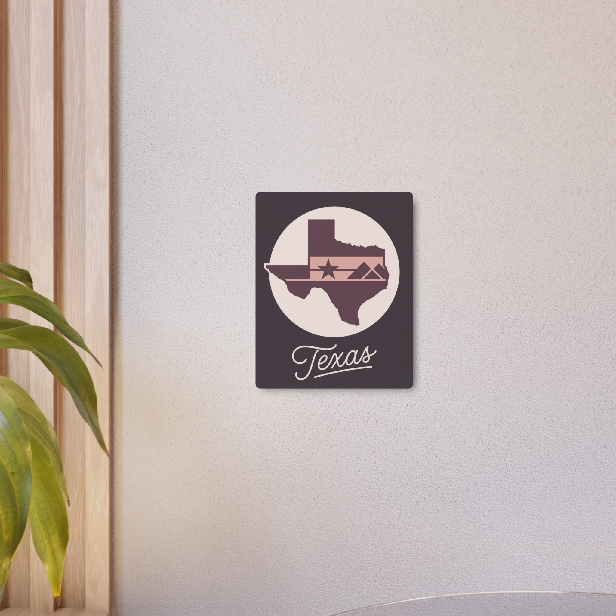 Small mauve metal wall art with circular Texas silhouette, star, and “Texas” script