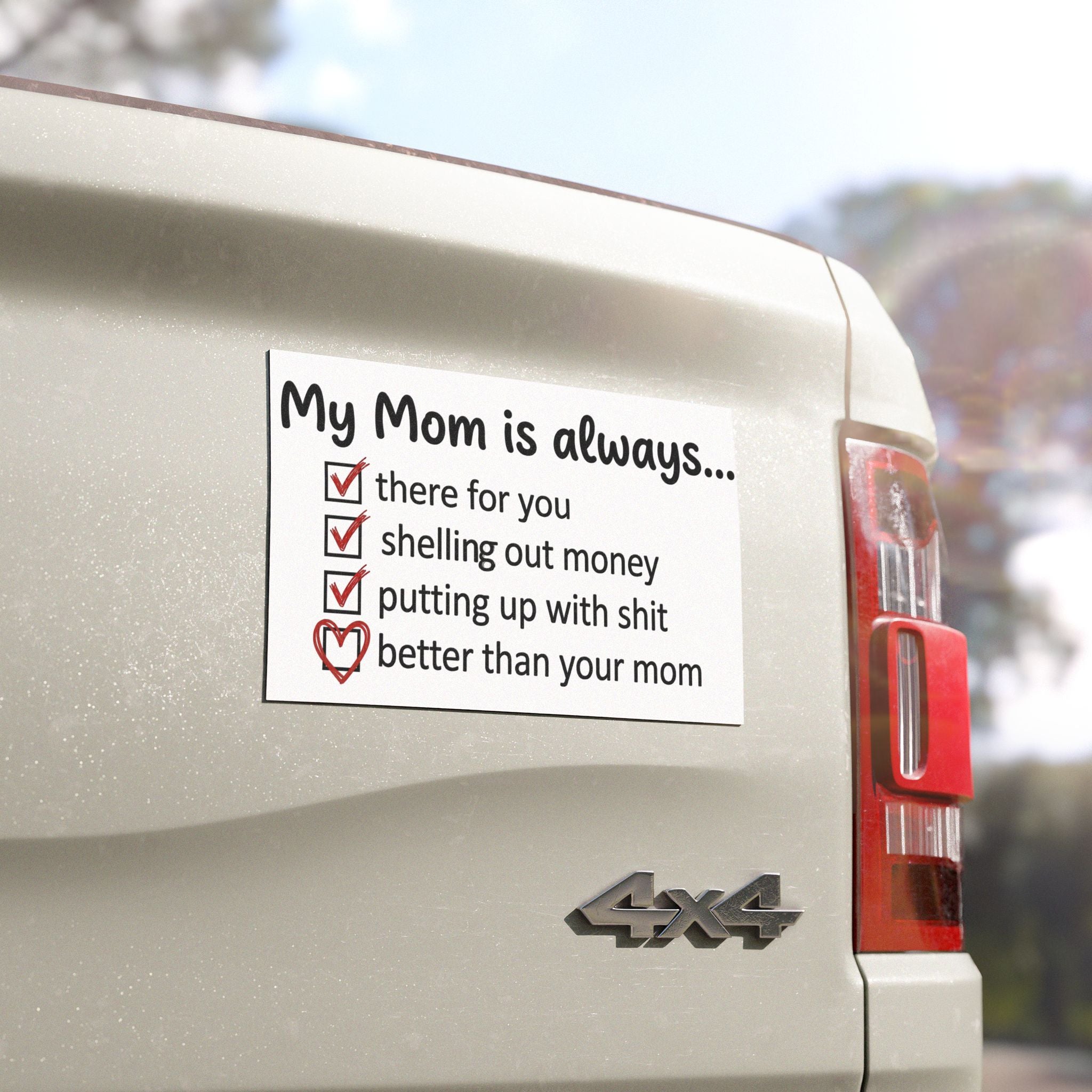 Close-up: rectangular car magnet reading “My Mom is always...” checklist and checkmarks