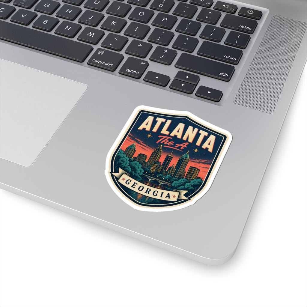 Atlanta Georgia luggage tag sticker on laptop lid, blue shield with city skyline