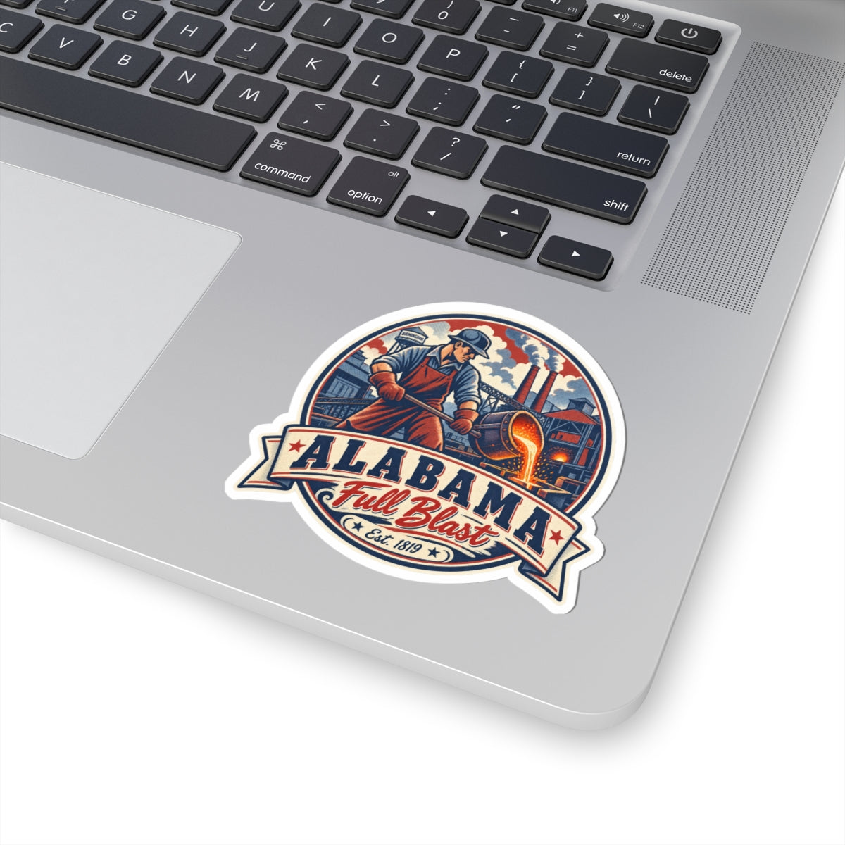 Alabama Full Blast sticker on laptop featuring worker, smokestacks, and ALABAMA banner