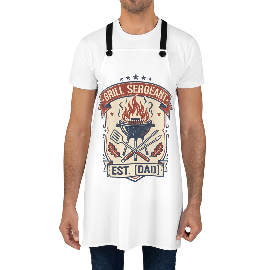 White grill apron with black neck-and-shoulder straps and "Est. Dad" badge.