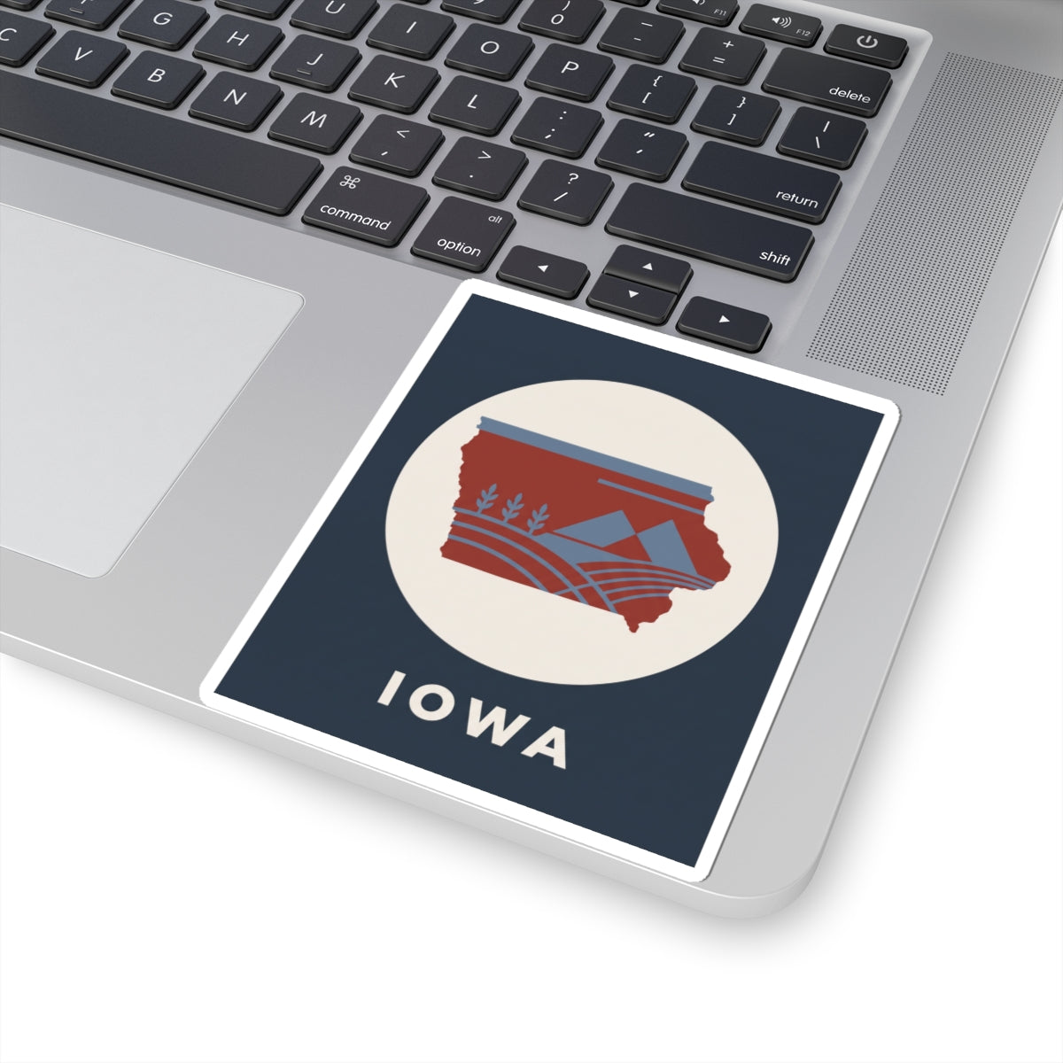 Square kiss-cut sticker featuring red Iowa map with blue accents and "IOWA" text
