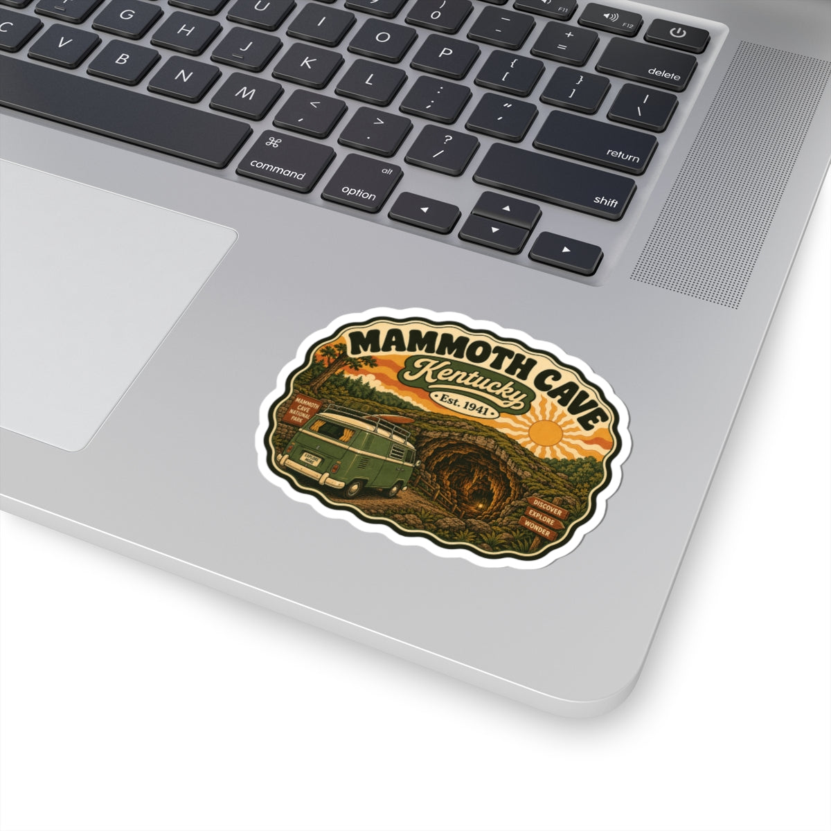 Mammoth Cave Kentucky sticker with white border showing green camper van and cave artwork