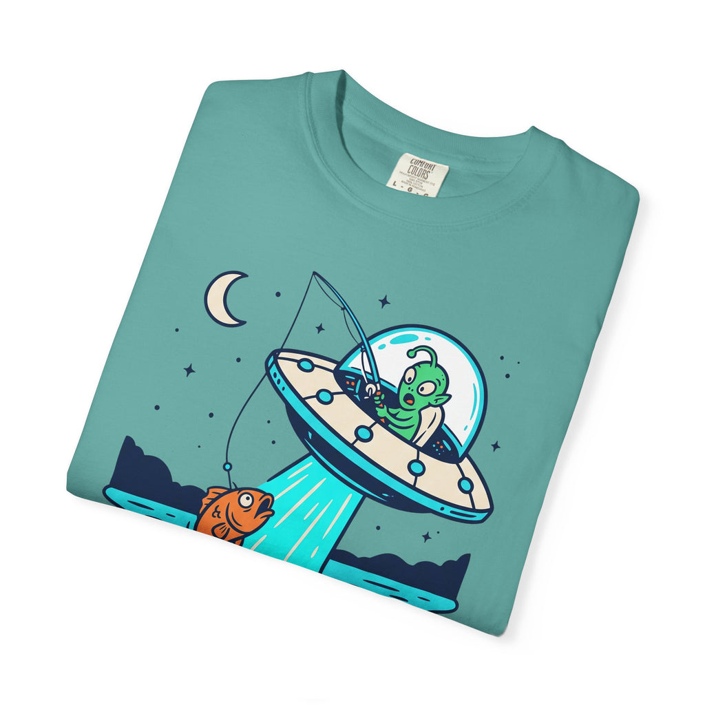 Teal T-shirt with alien fishing UFO graphic and crescent moon on the front.