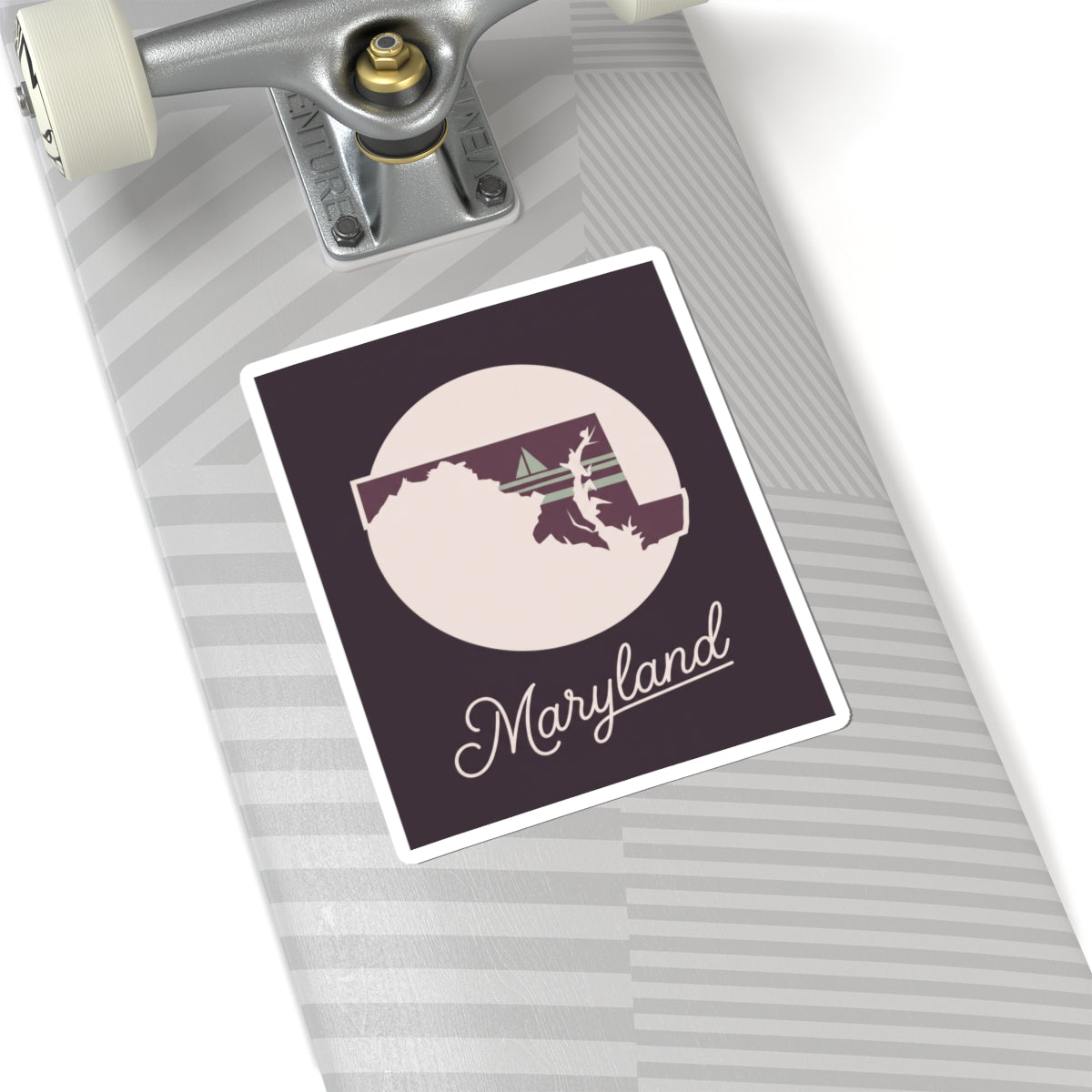 Maryland state silhouette vinyl sticker: circular badge, mauve background, and “Maryland” script