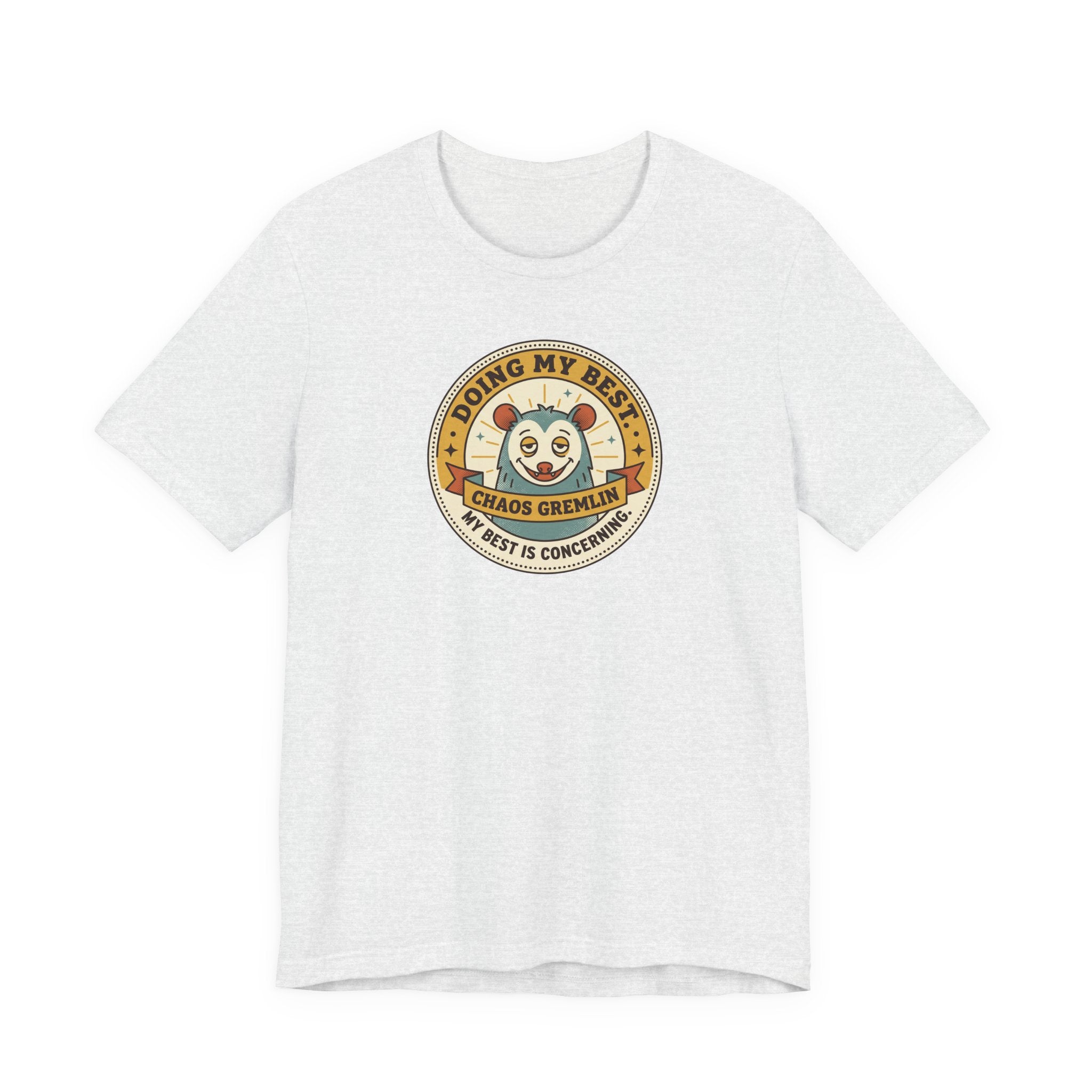 Light gray T-shirt with round gremlin badge graphic on center chest