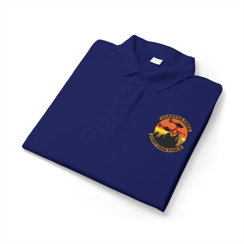 Navy polyester polo shirt folded with embroidered chest badge and logo