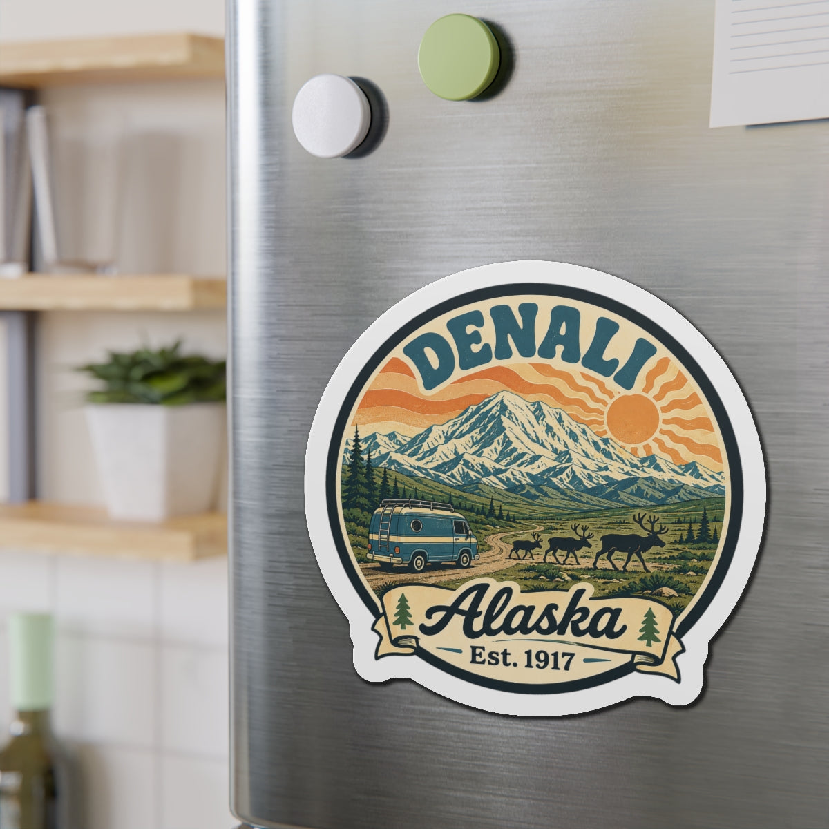 Round die-cut Denali Alaska fridge magnet with mountain range and grazing animals graphic