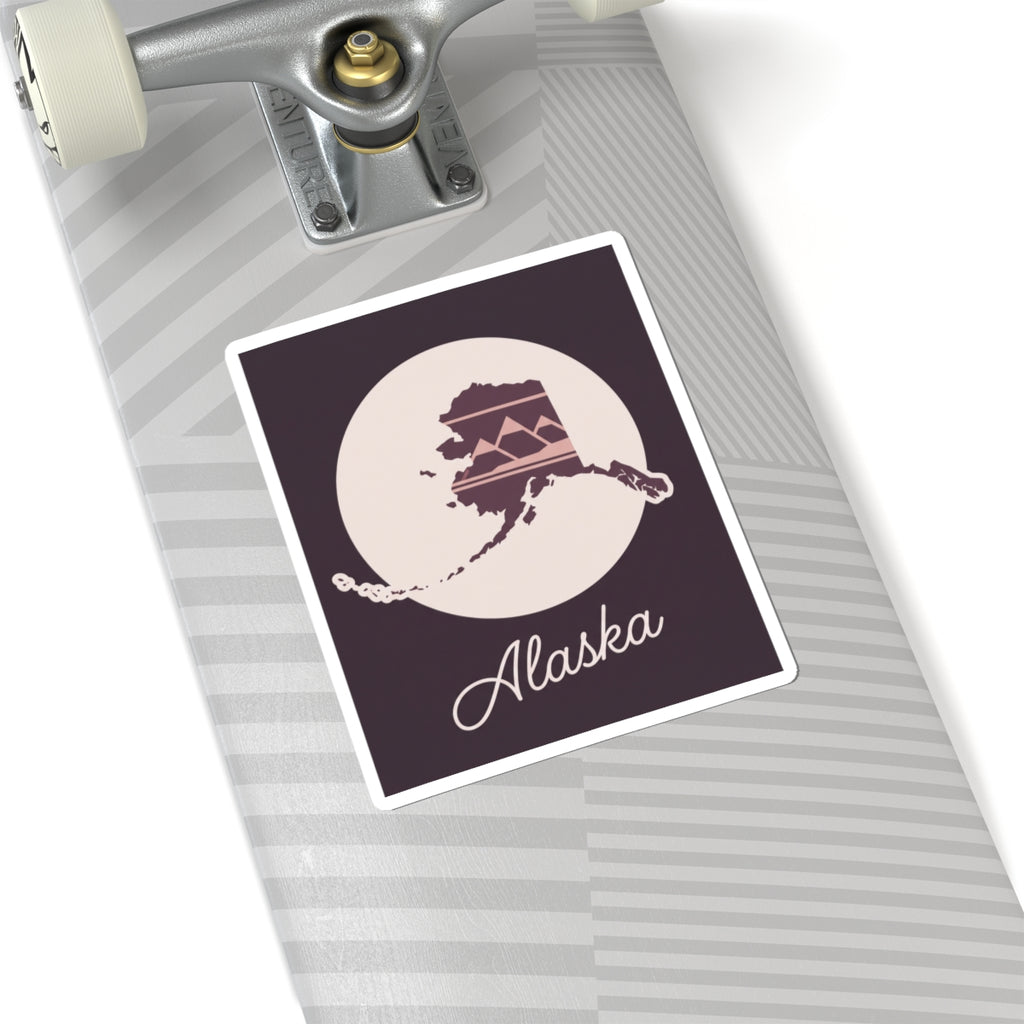 Square Alaska silhouette vinyl decal with white outline, cream moon, mauve Alaska map, cursive