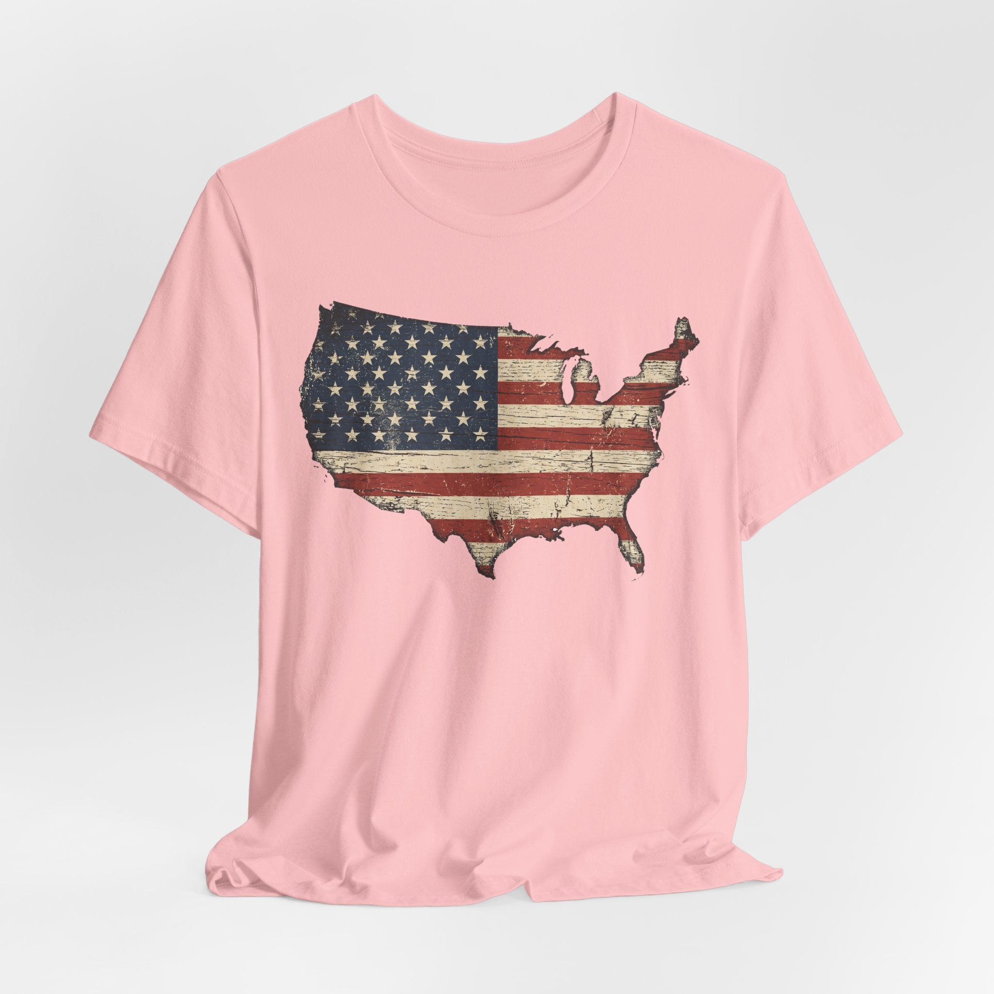 Light pink crew-neck T-shirt with distressed American flag map graphic on front.