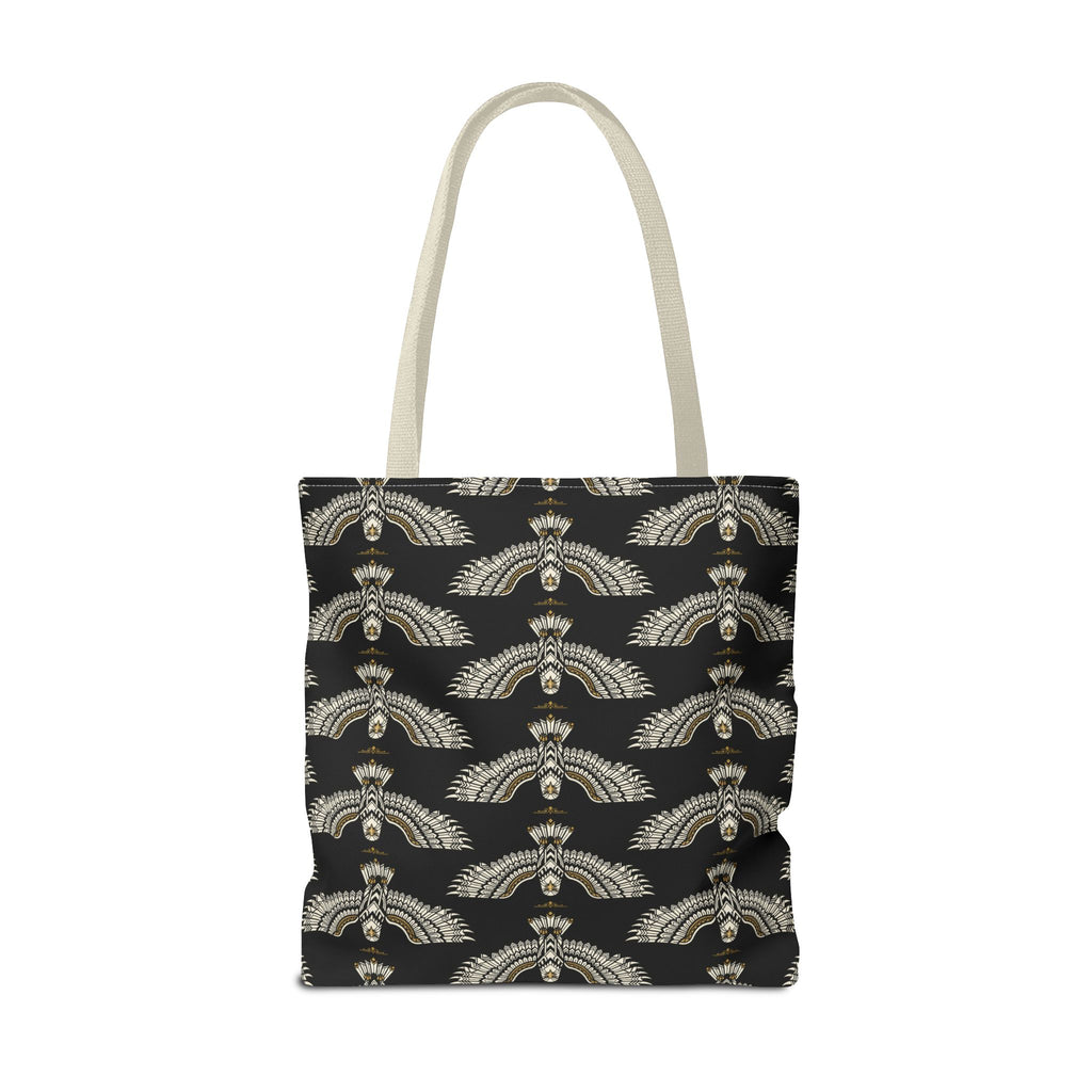 Black tote bag front view with repeating winged scarab pattern in pale gold; tote handles