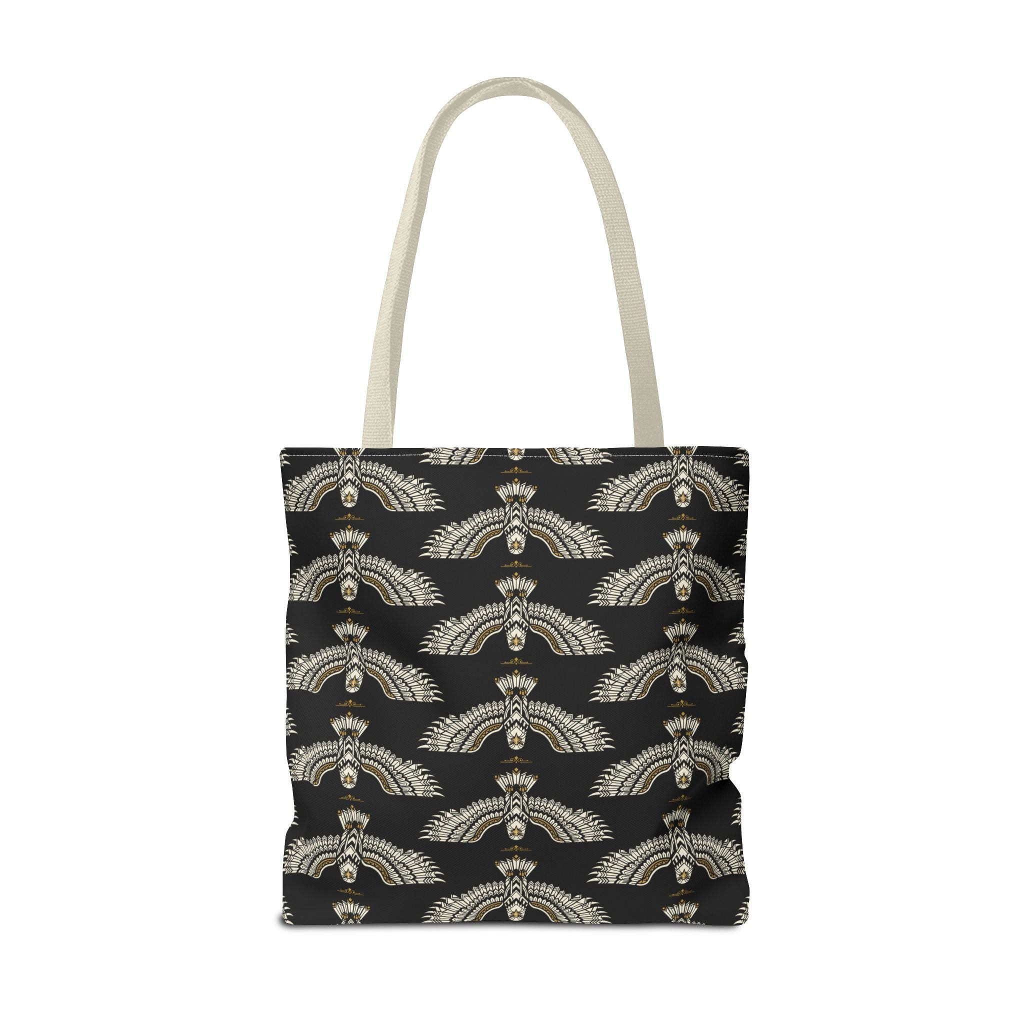 Black tote bag front view with repeating winged scarab pattern in pale gold; tote handles
