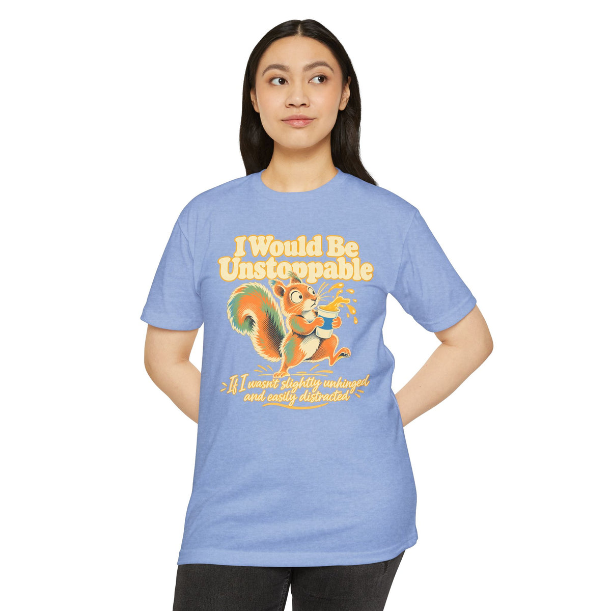 Light blue crewneck T-shirt with colorful squirrel graphic and humorous text on front.