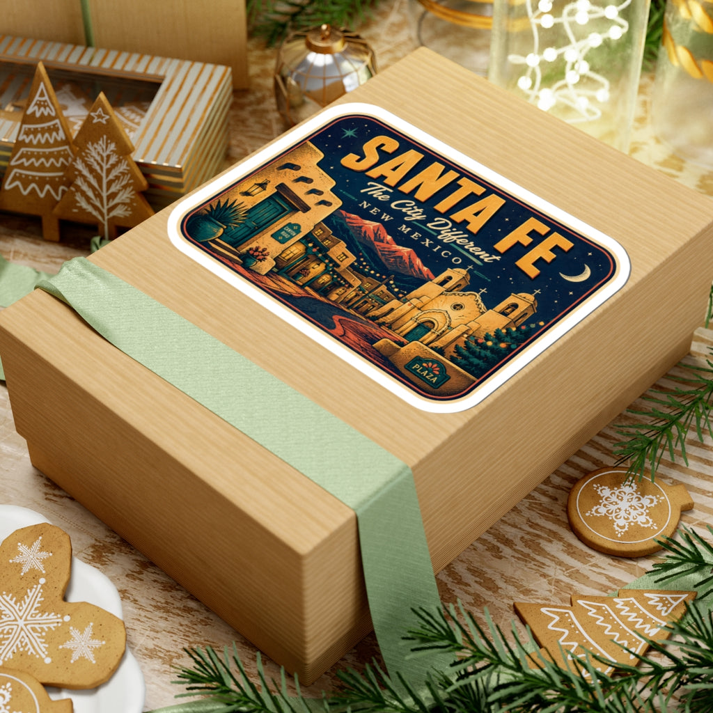 Santa Fe luggage tag sticker on a wrapped gift, rectangular decal with plaza building artwork.