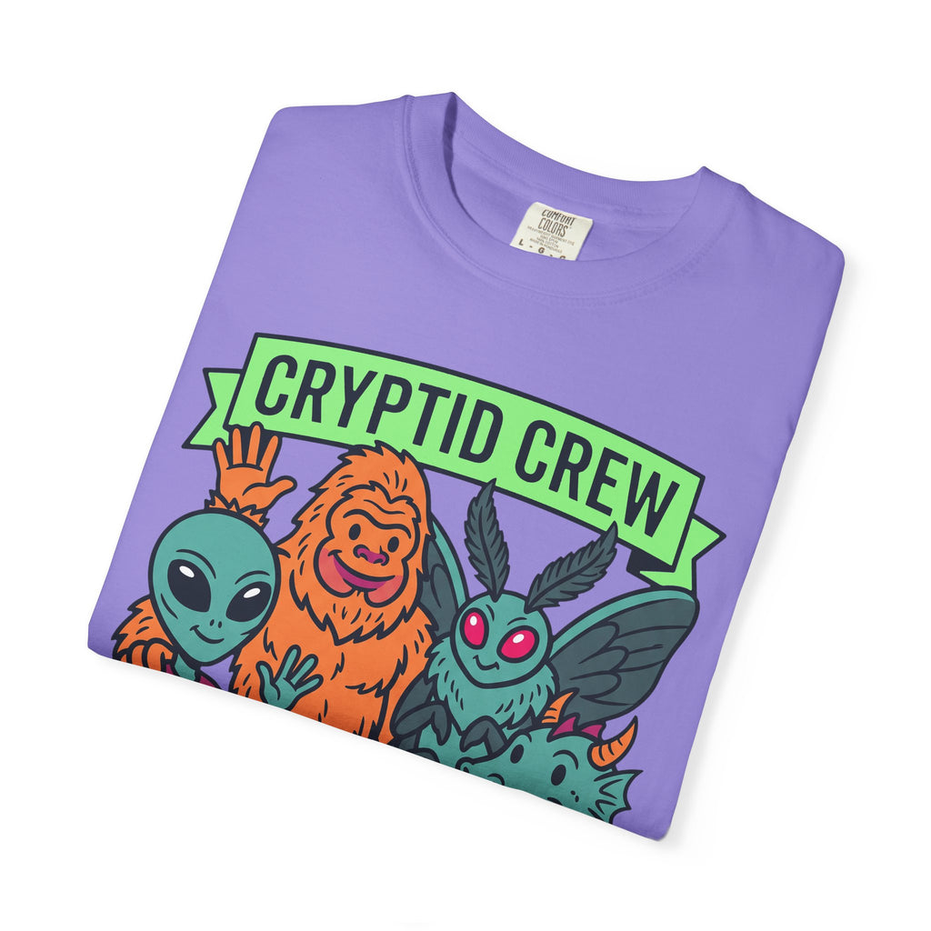 Lavender T-shirt with green CRYPTID CREW banner and colorful cryptid characters