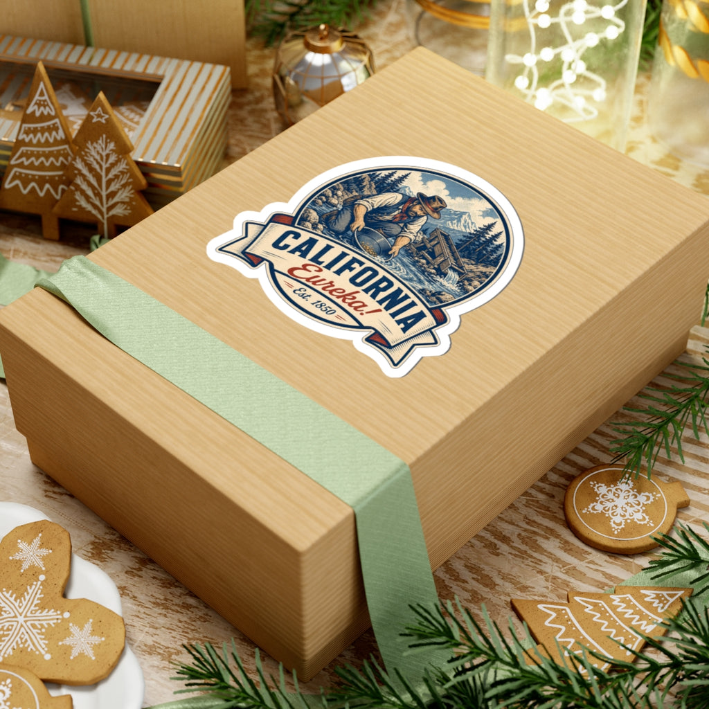 California Eureka! miner badge sticker on wrapped gift, blue circular design Est. 1850