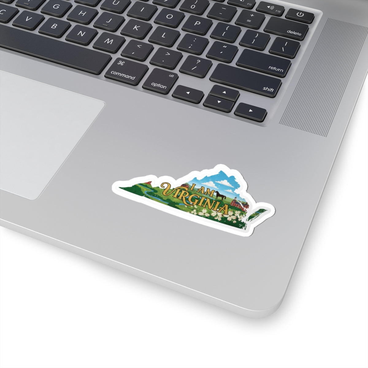 I Am Virginia sticker on laptop, die-cut white outline with illustrated landscape