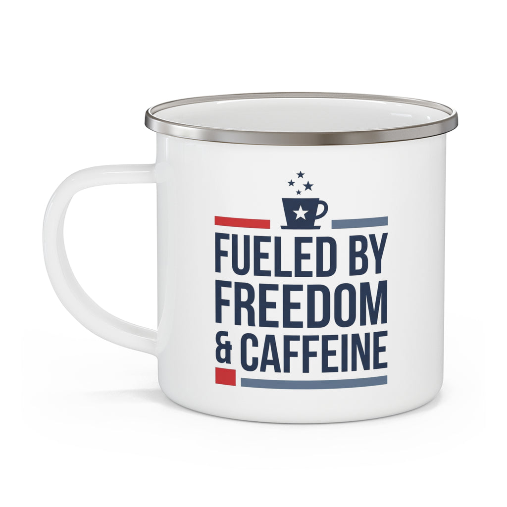 White enamel camping mug with handle, featuring 'Fueled by Freedom & Caffeine' graphic