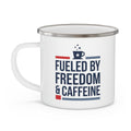 White enamel camping mug with handle, featuring 'Fueled by Freedom & Caffeine' graphic