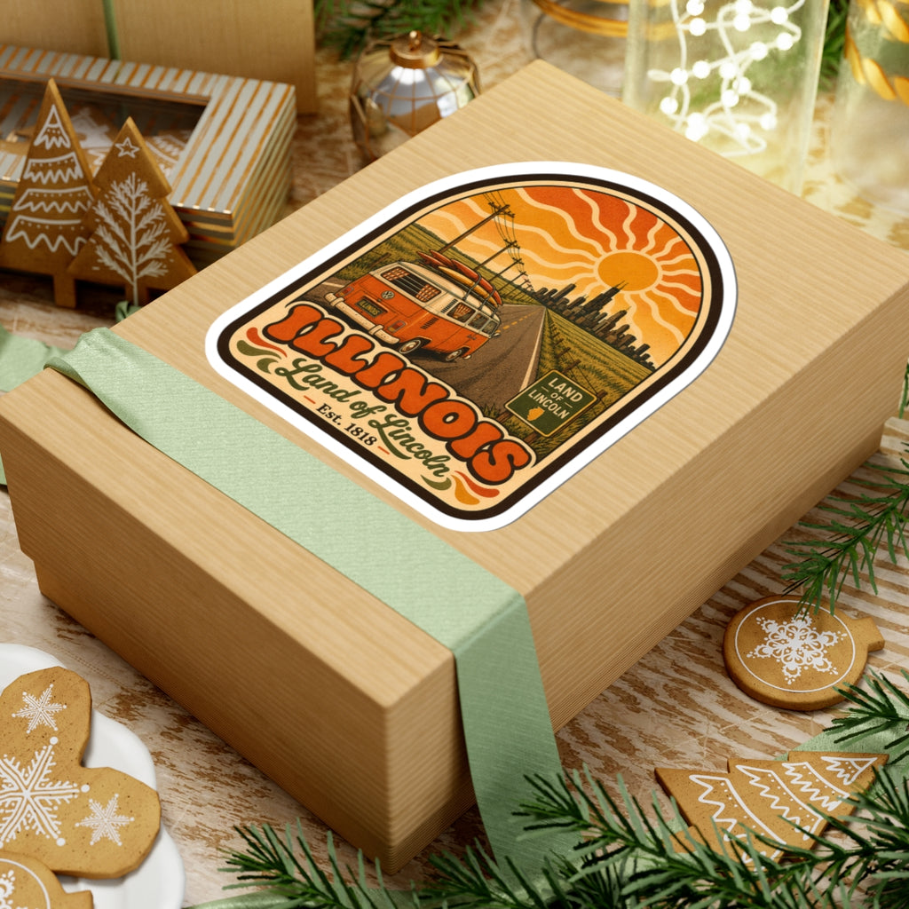 Kiss-cut sticker on wrapped gift: orange camper van on road, Illinois text and Est. 1818