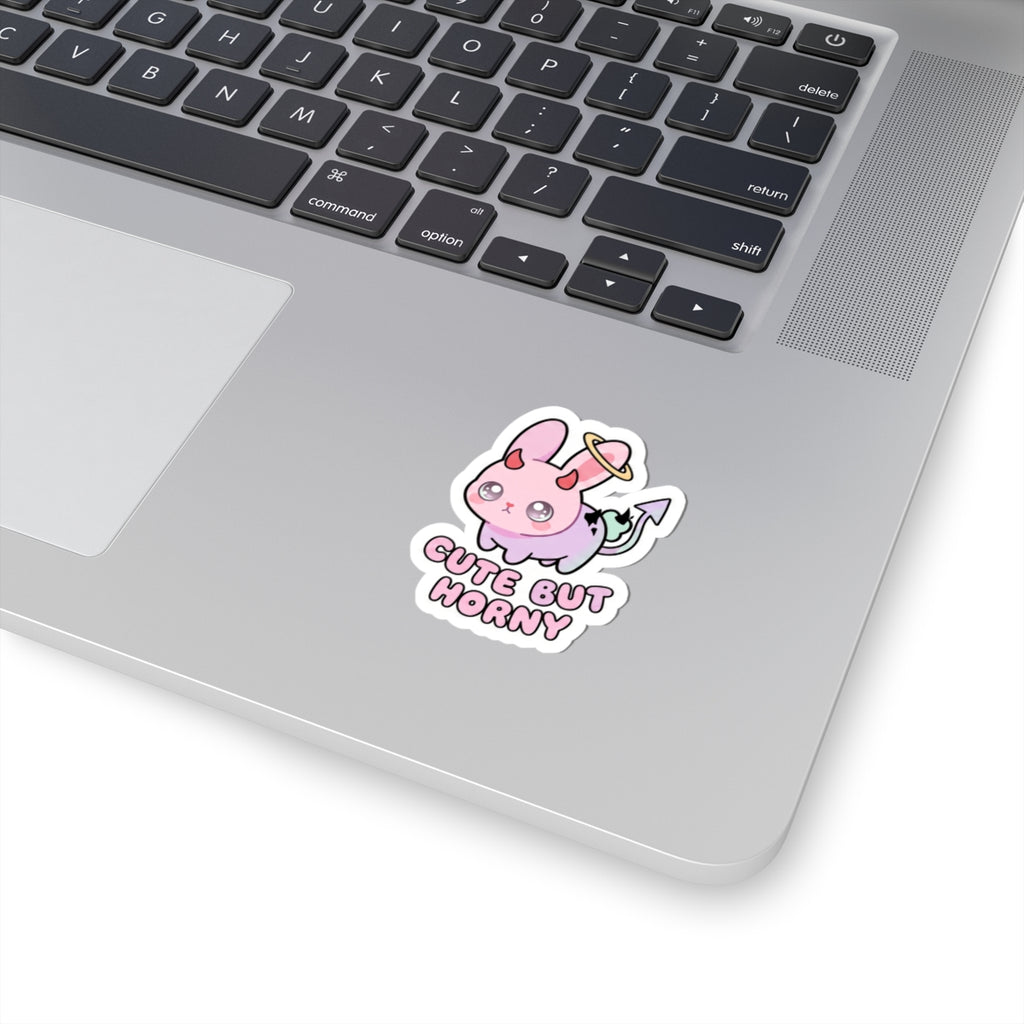 Pastel pink bunny demon sticker with horns and the words 'CUTE BUT HORNY'