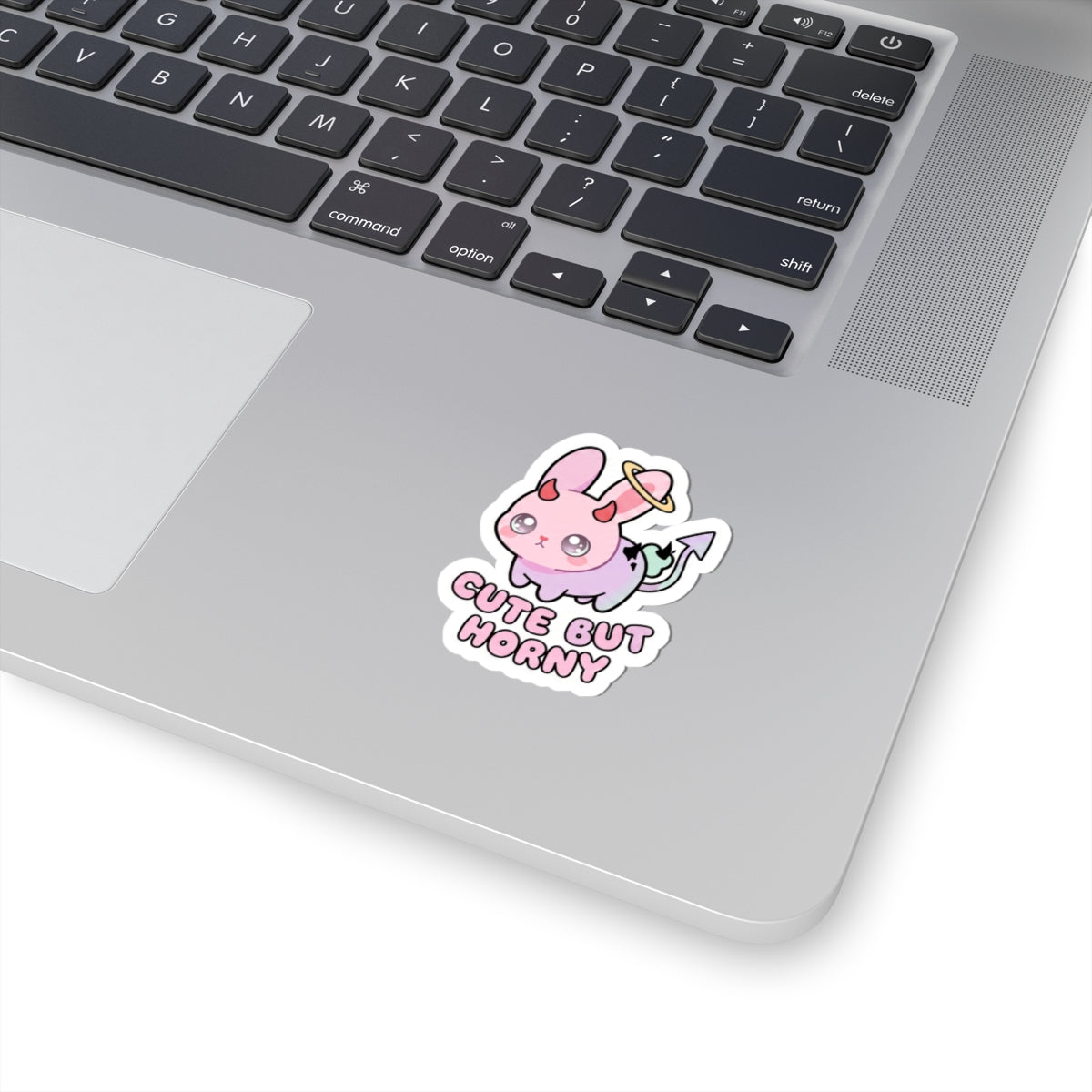 Pastel pink bunny demon sticker with horns and the words 'CUTE BUT HORNY'