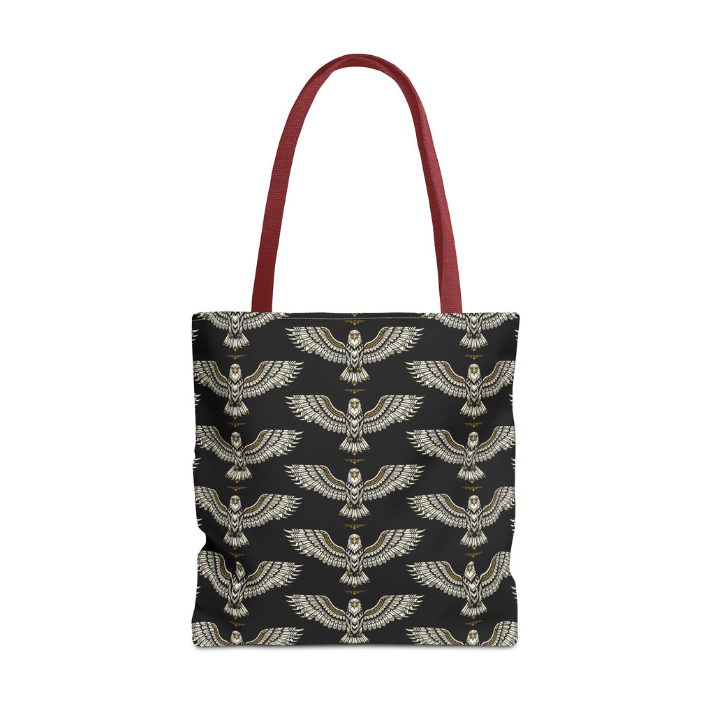 Tote bag with black fabric and repeating gold winged scarab pattern, red handles