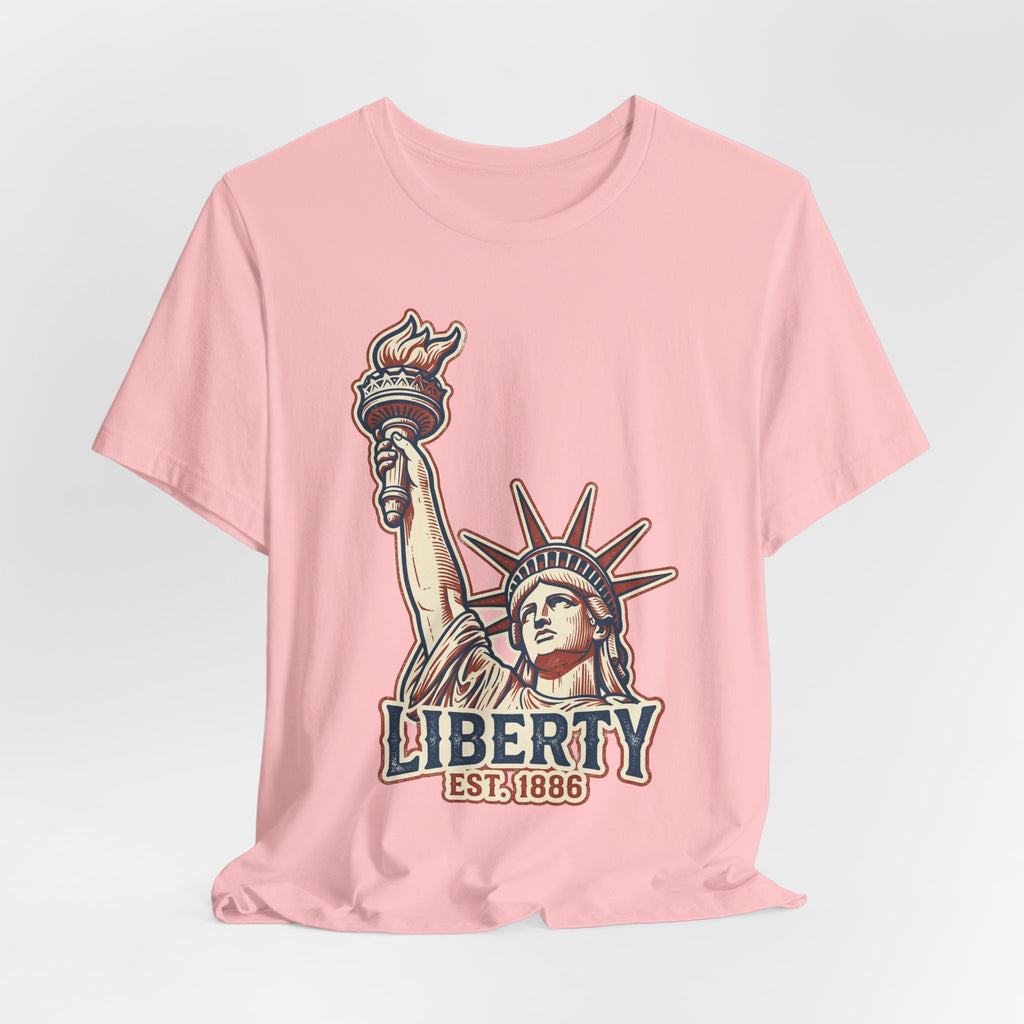 Light pink graphic tee with Liberty Statue illustration and LIBERTY EST. 1886