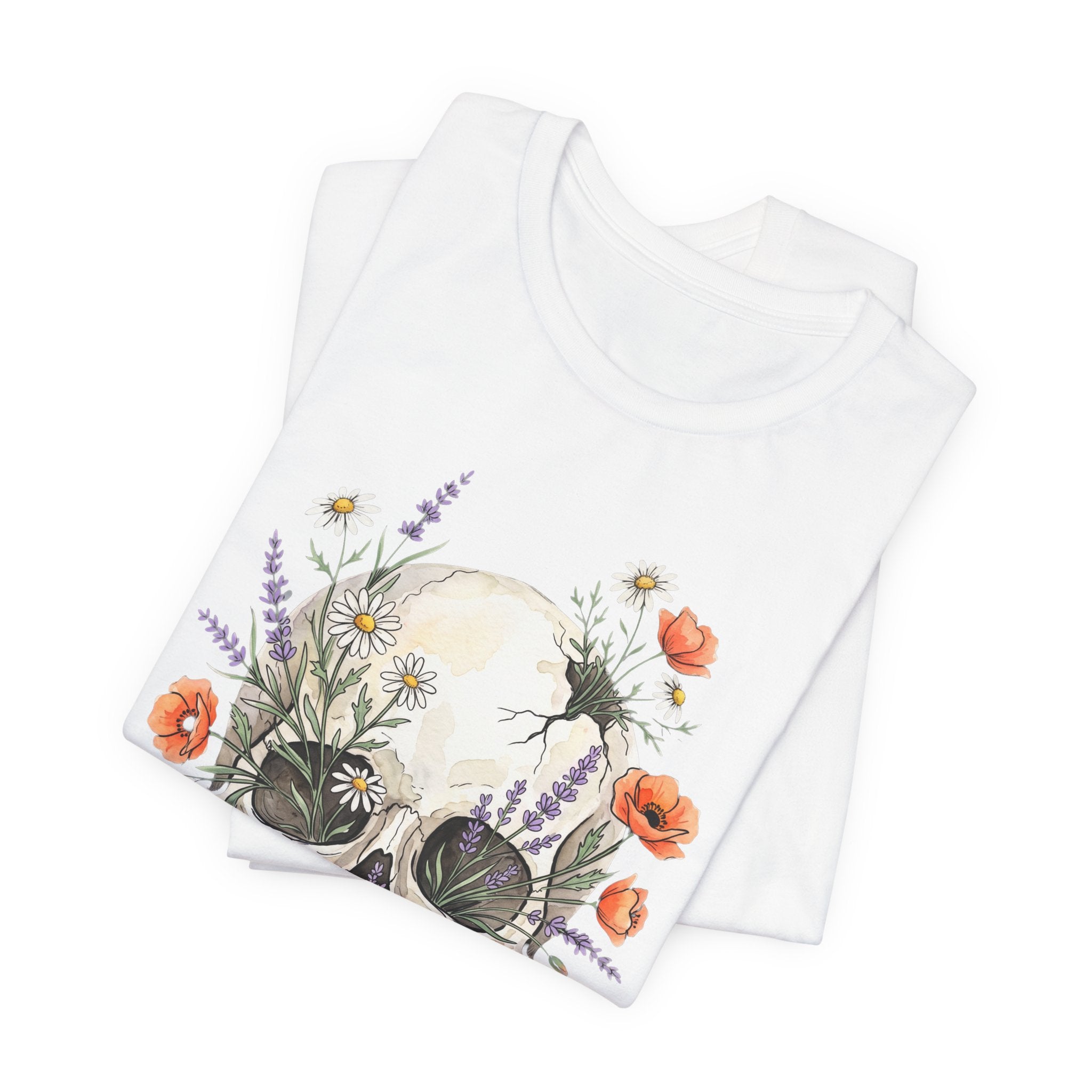 White floral skull T-shirt front graphic with poppies and wildflowers on folded tee