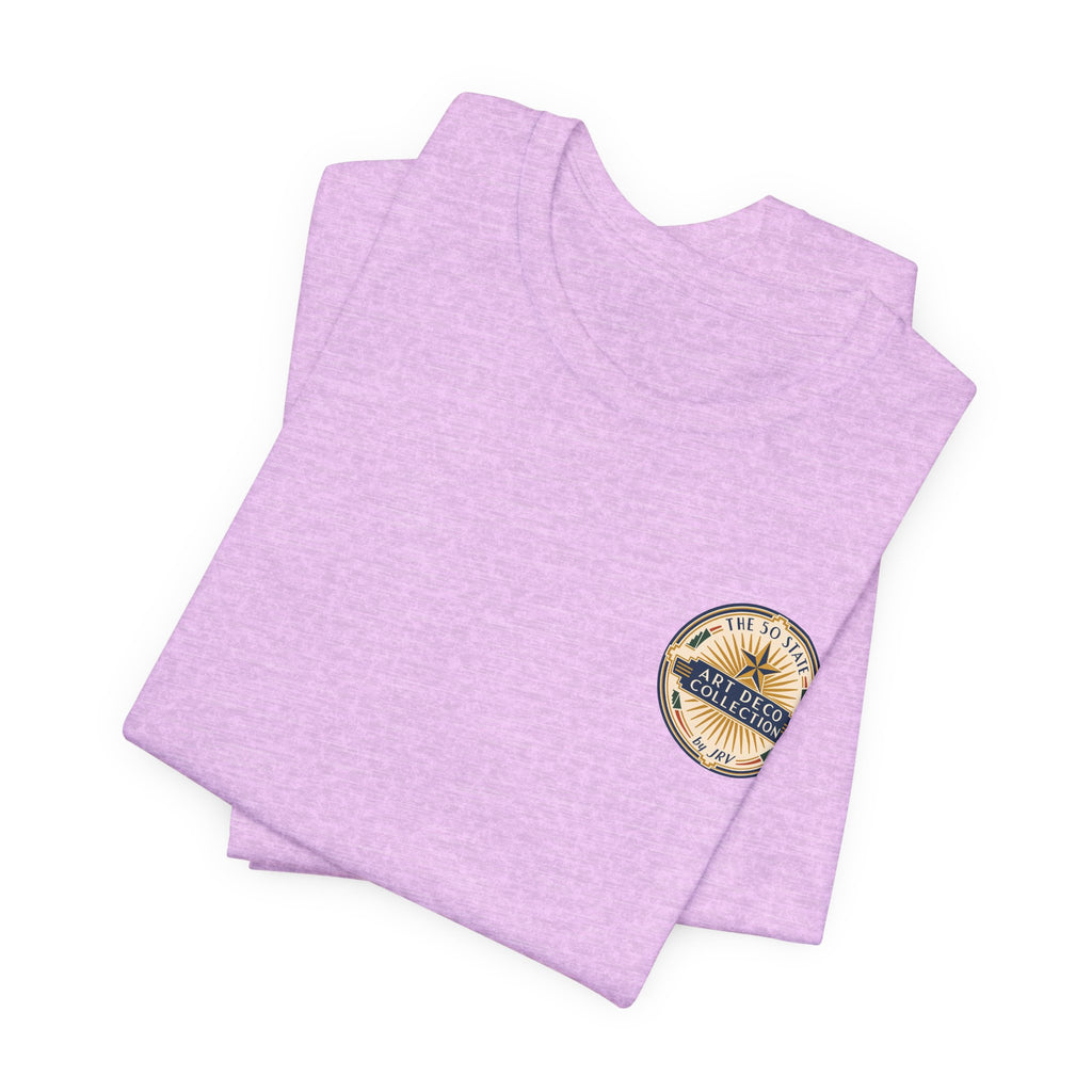Lavender crewneck T-shirt with small round logo patch on chest.