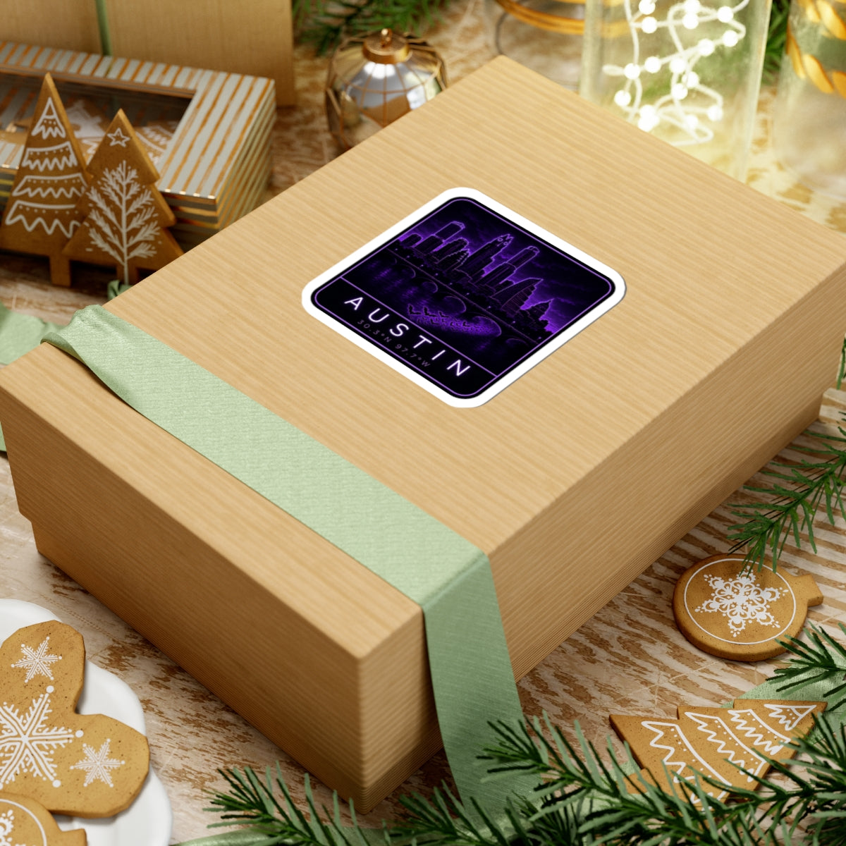 Neon Austin skyline sticker on wrapped gift; purple cityscape with “AUSTIN” and coordinates